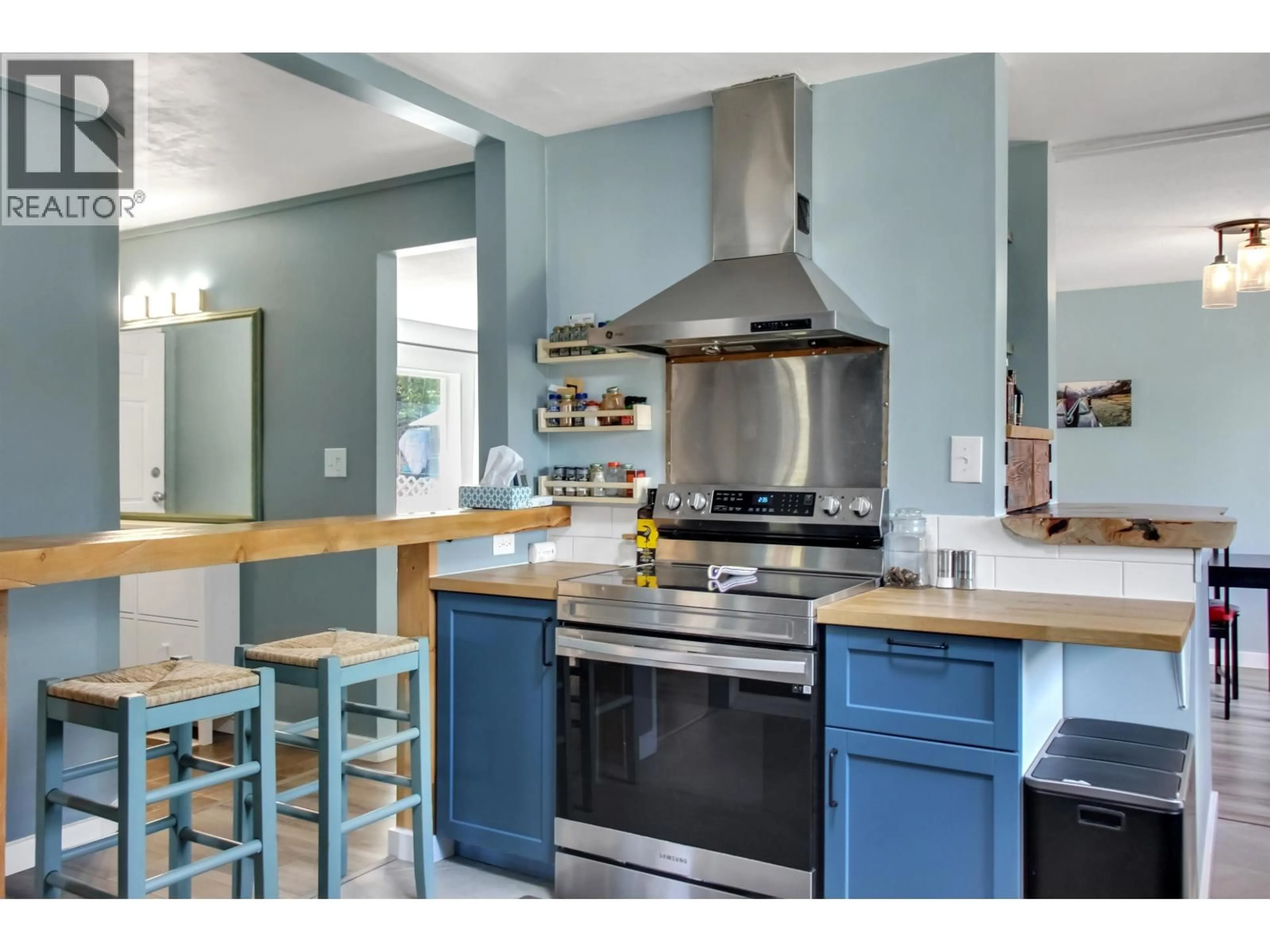 Open concept kitchen, ceramic/tile floor for 6332 MULLIGAN DRIVE, 100 Mile House British Columbia V0K2E3