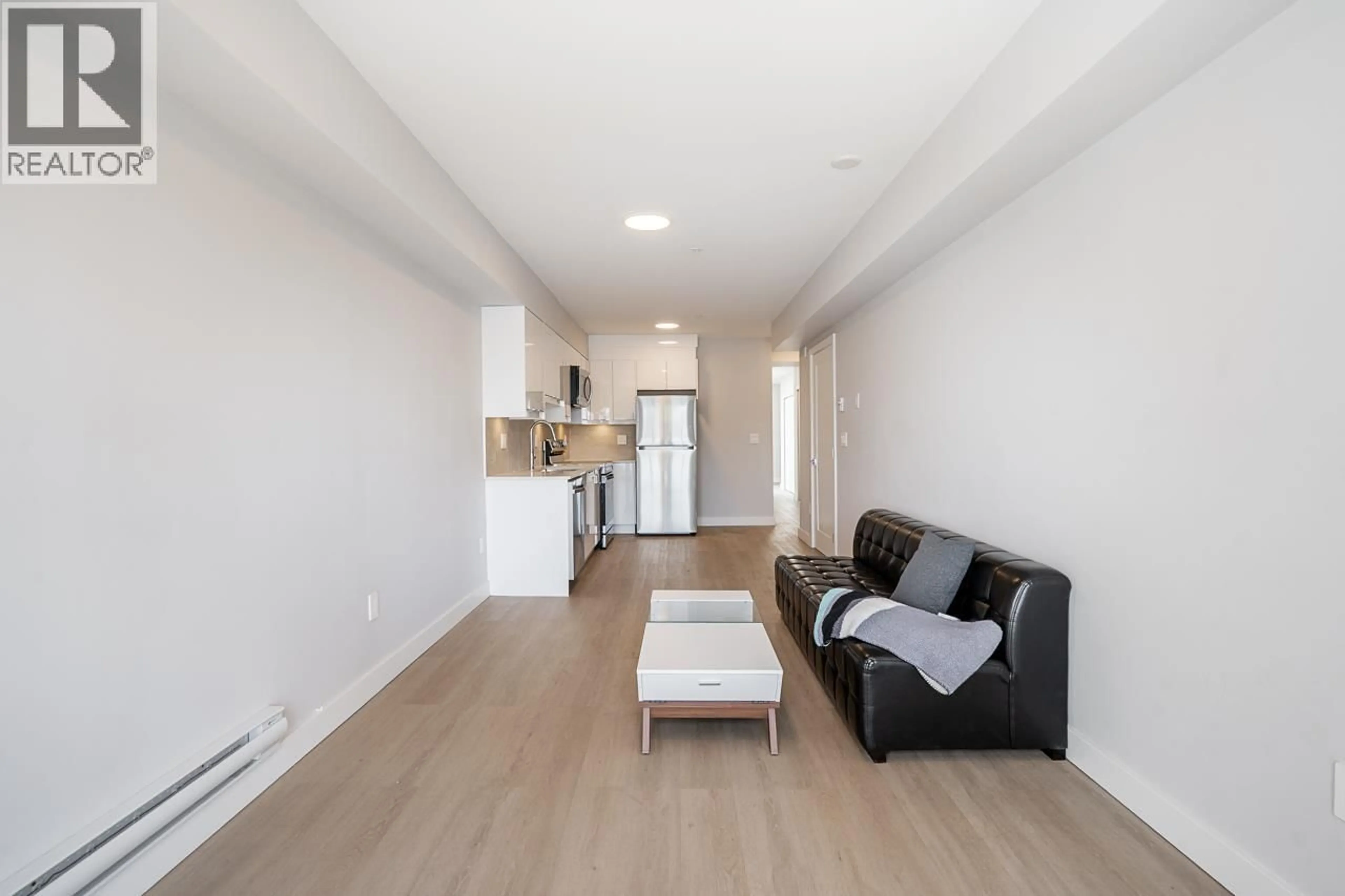 Living room with furniture, wood/laminate floor for 304 - 3050 KINGSWAY, Vancouver British Columbia V5R5J7