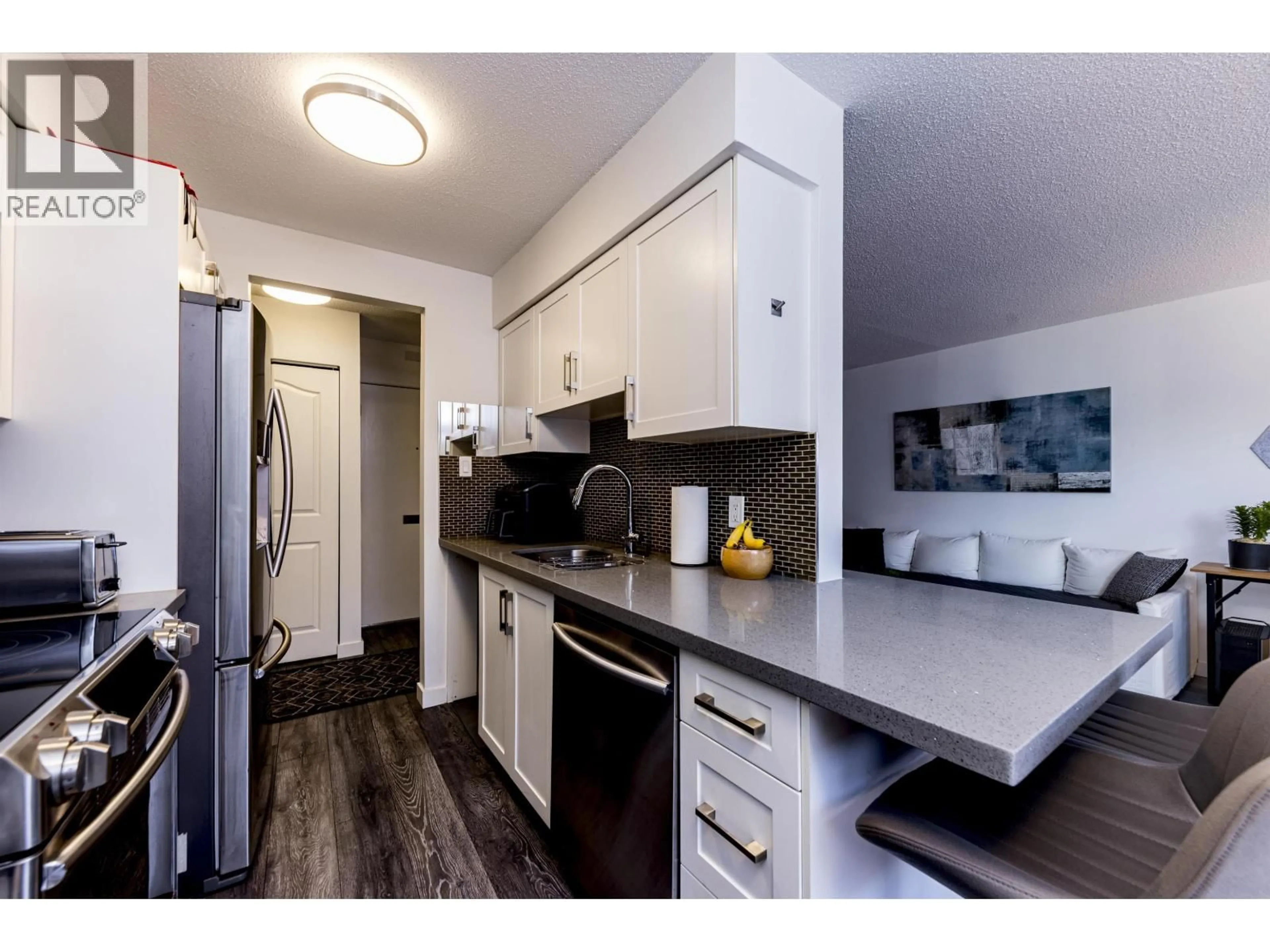 Standard kitchen, wood/laminate floor for 208 - 160 19TH STREET, North Vancouver British Columbia V7L2Y8