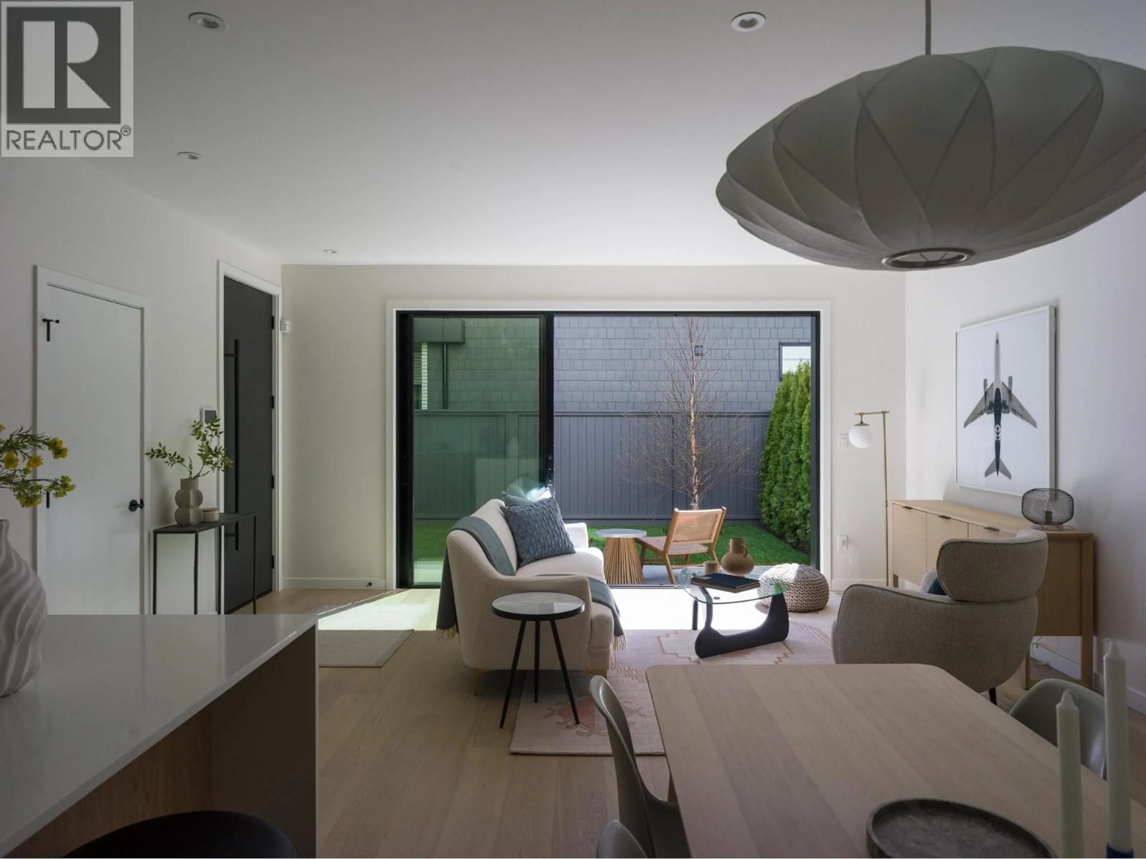 Living room with furniture, cement floor for 3679 ST CATHERINES STREET, Vancouver British Columbia V5V1S3