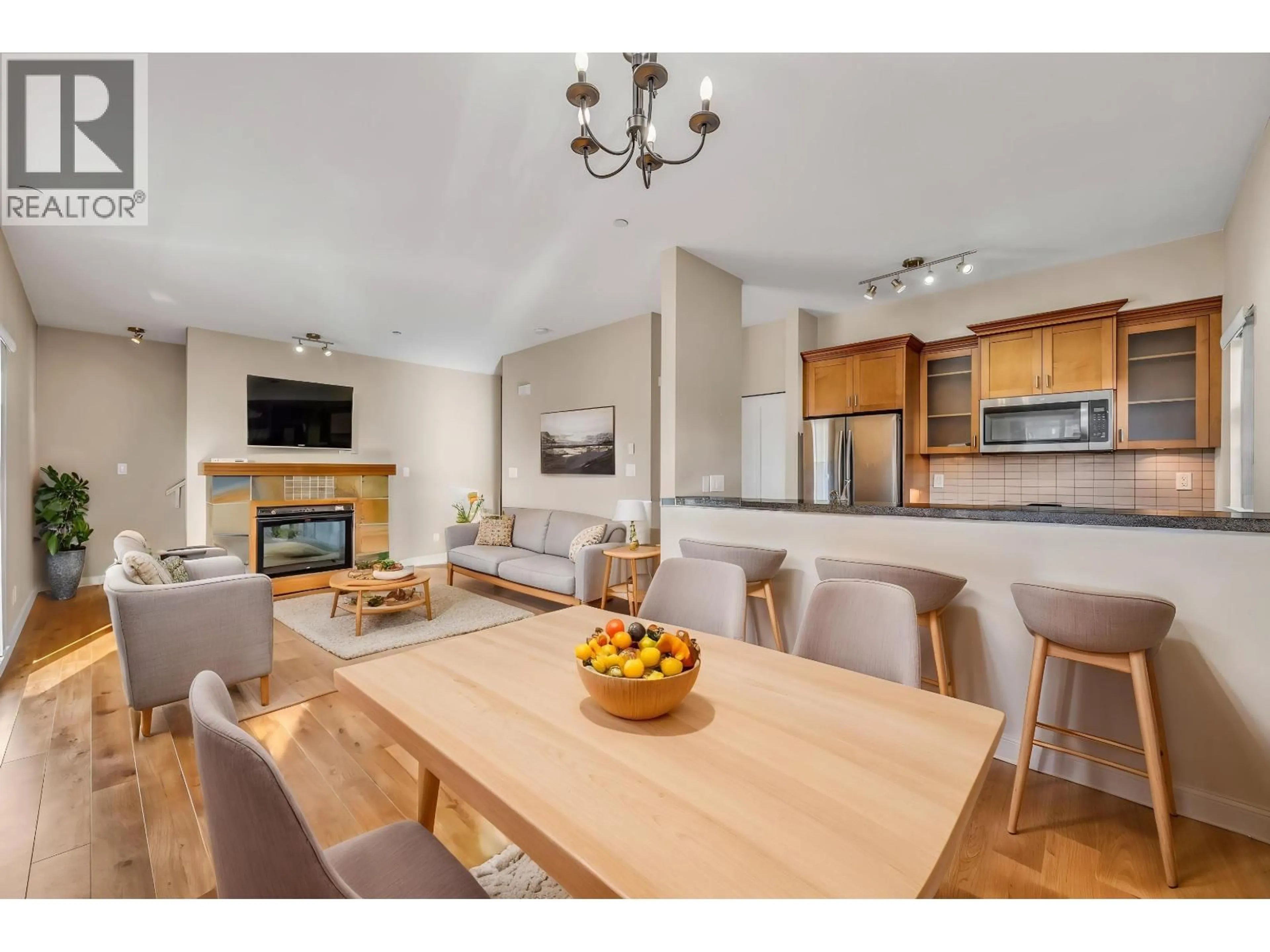 Open concept kitchen, wood/laminate floor for 157 - 7388 MACPHERSON AVENUE, Burnaby British Columbia V5J0A1