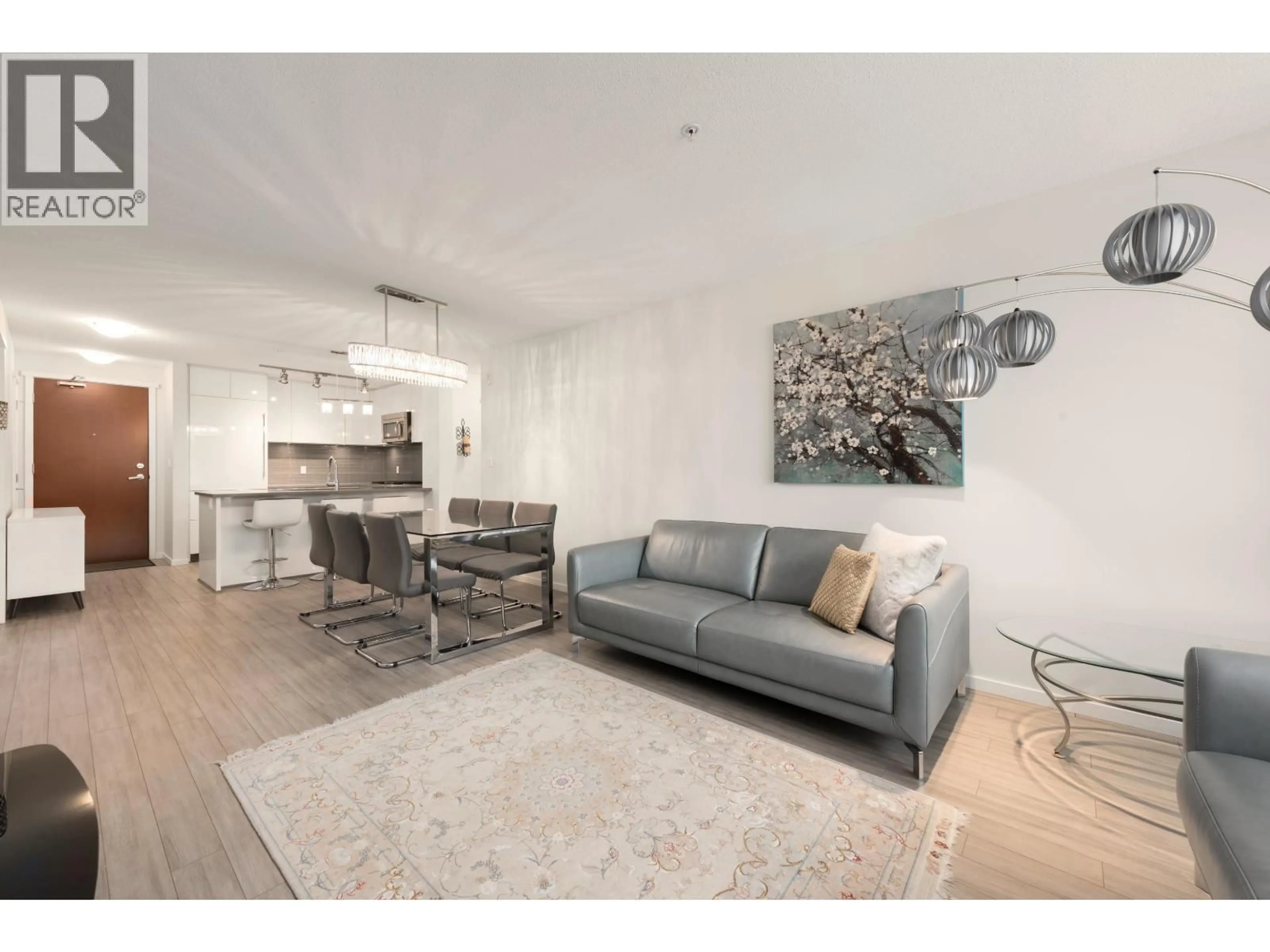 Living room with furniture, wood/laminate floor for 305 - 1128 KENSAL PLACE, Coquitlam British Columbia V3B0J2