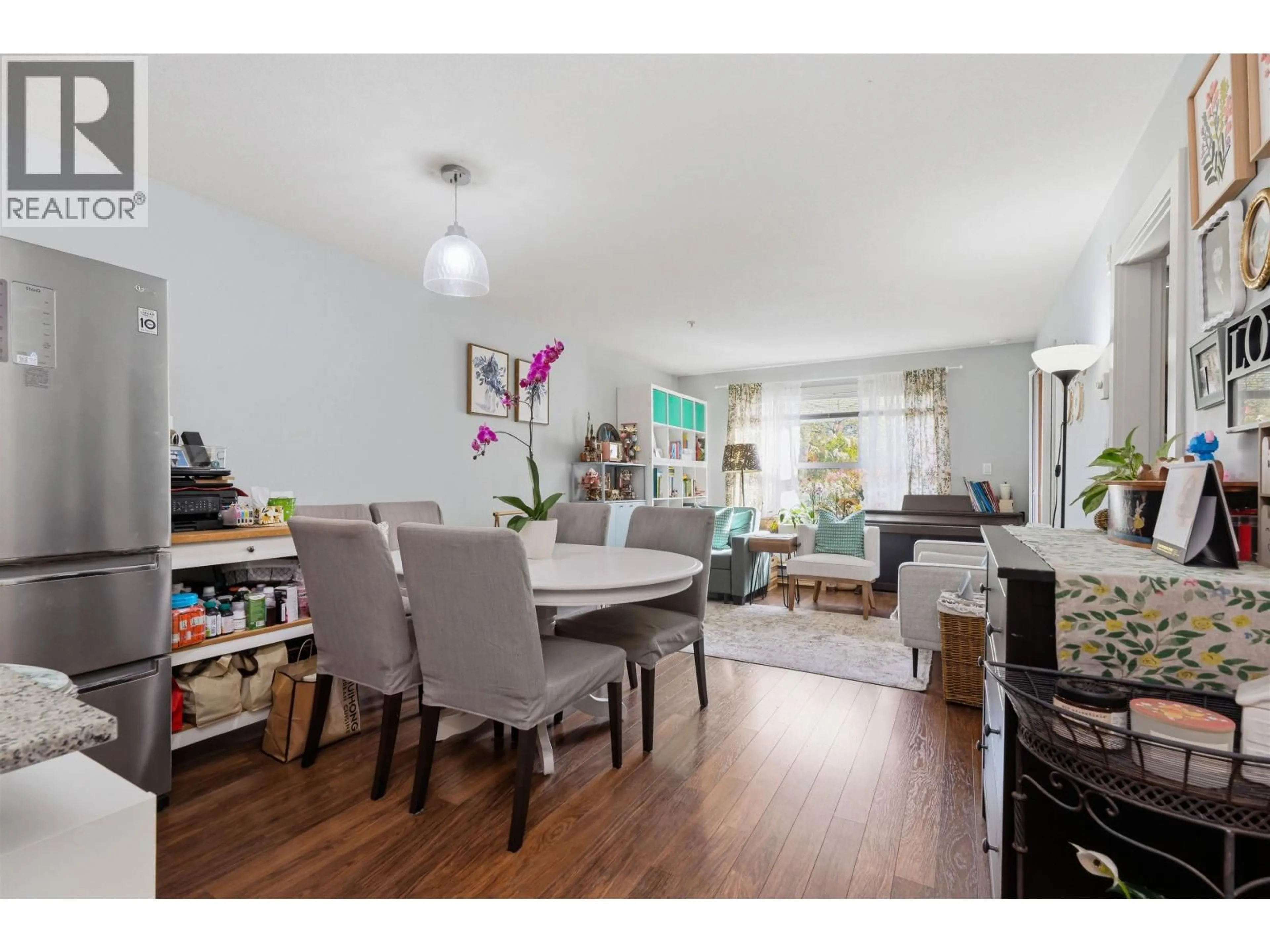 Living room with furniture, wood/laminate floor for 109 - 5889 IRMIN STREET, Burnaby British Columbia V5J0C1