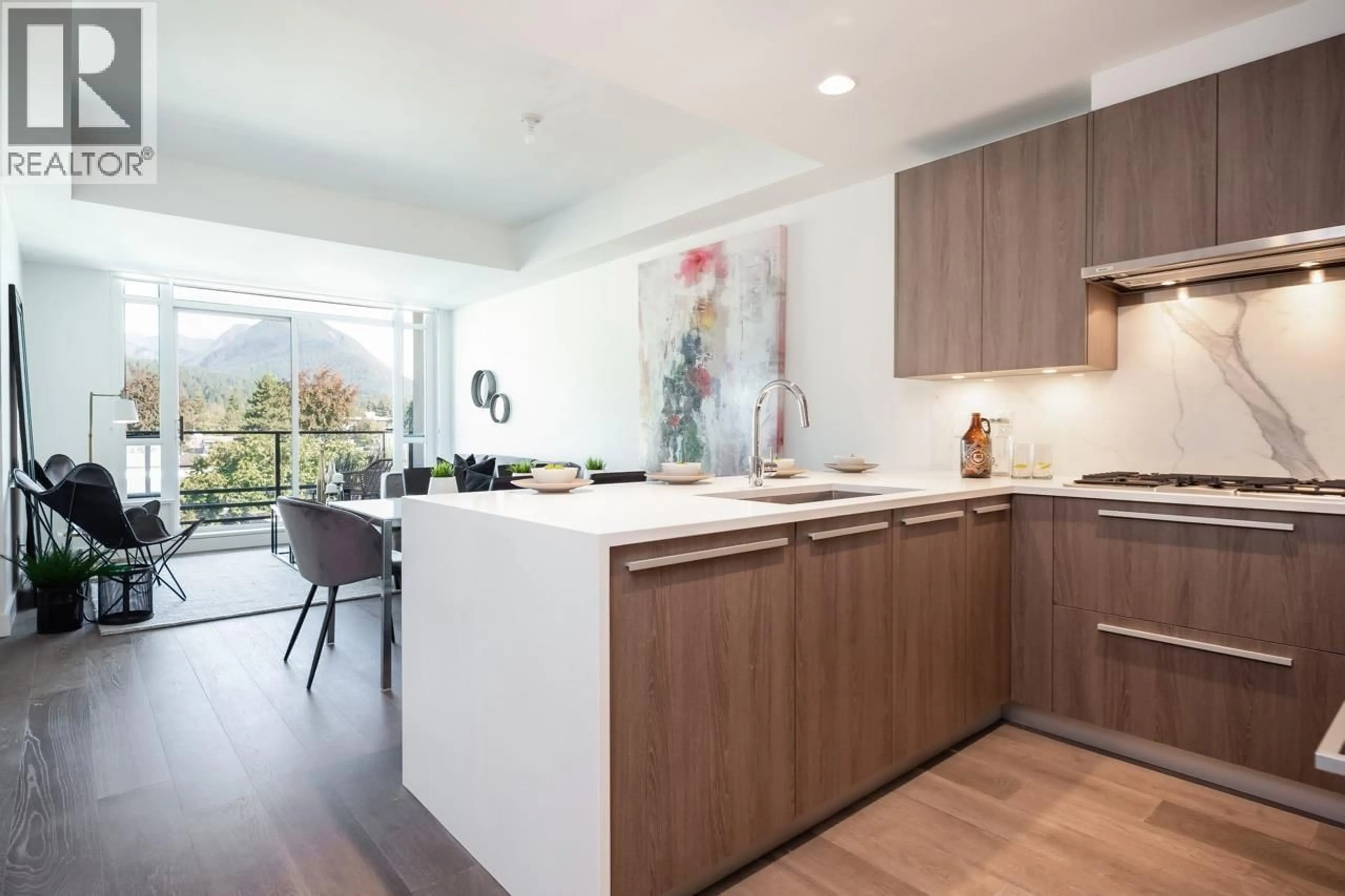 Open concept kitchen, wood/laminate floor for 404 - 1295 CONIFER STREET, North Vancouver British Columbia V7J0B4