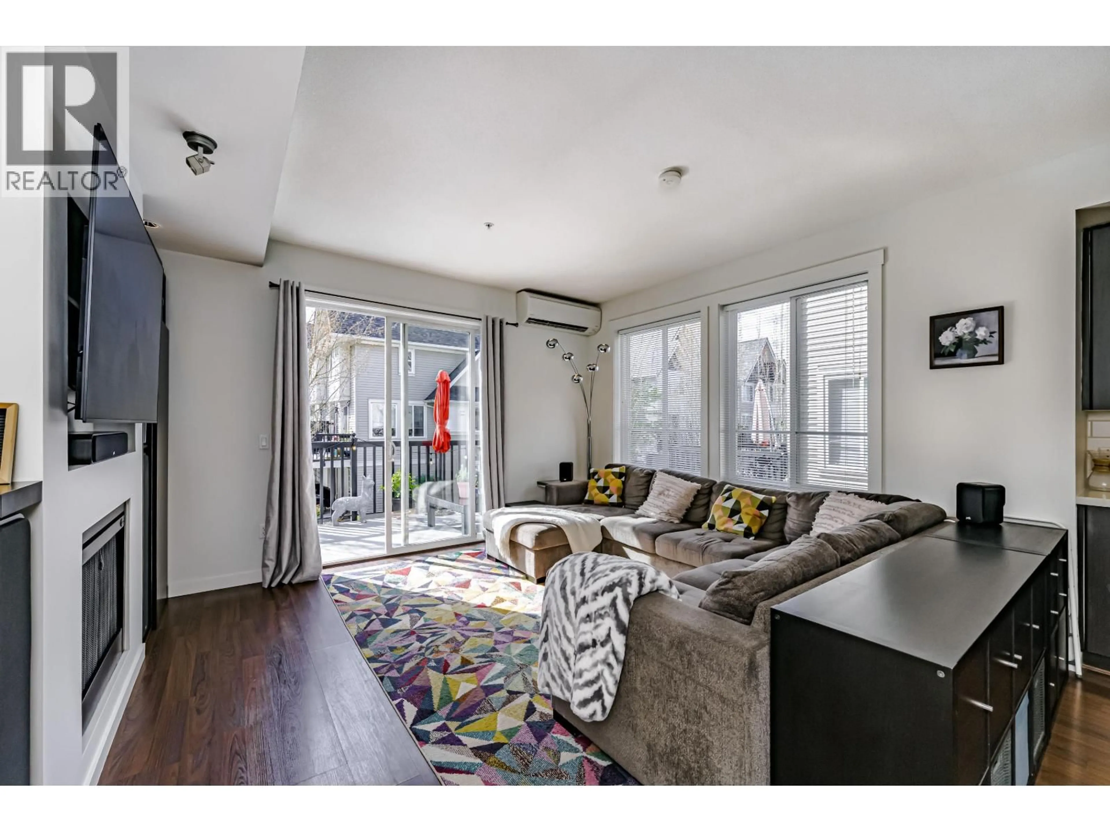 Living room with furniture, wood/laminate floor for 34 - 2418 AVON PLACE, Port Coquitlam British Columbia V3B0C7