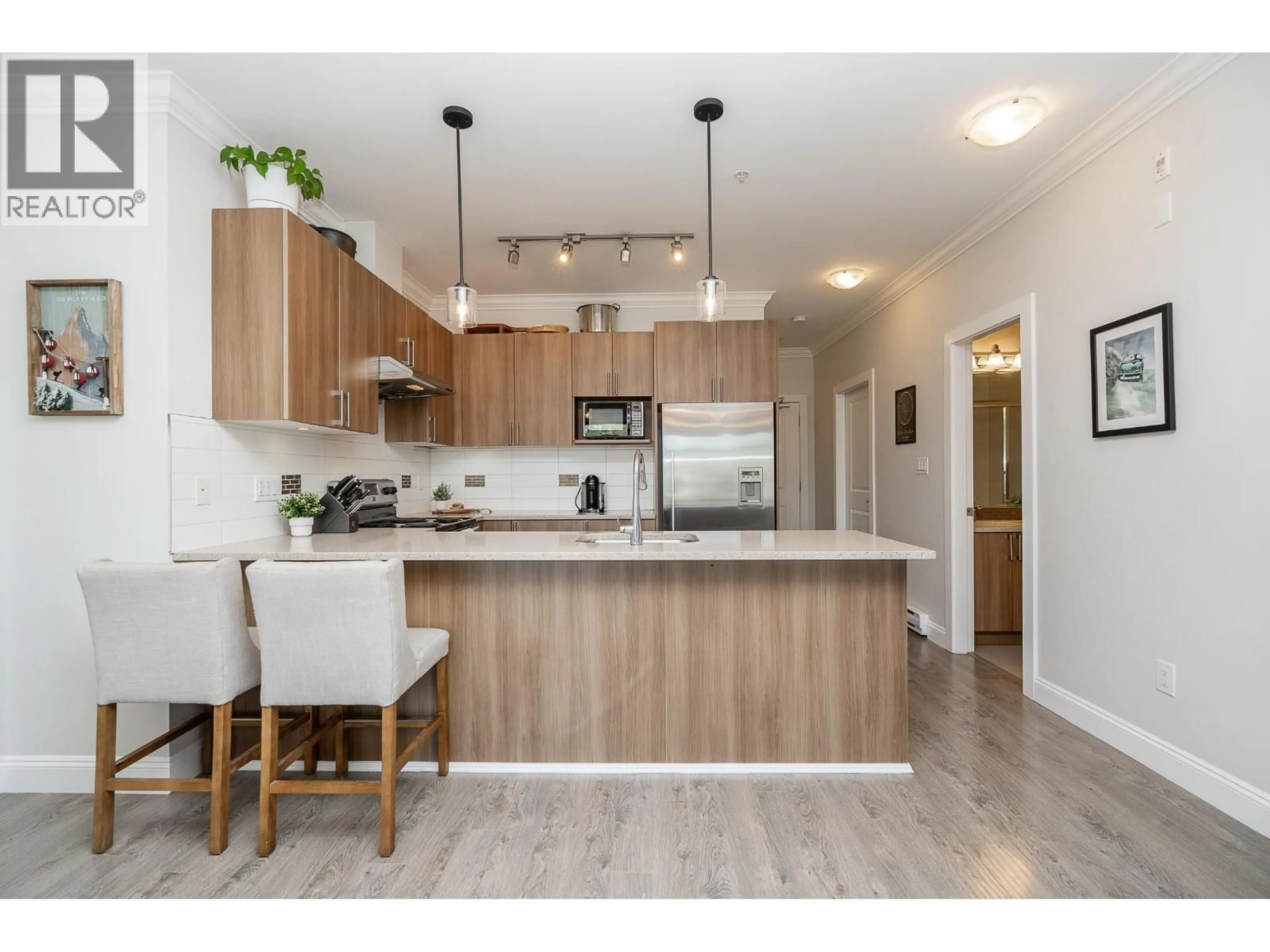 Open concept kitchen, wood/laminate floor for 309 - 11566 224 STREET, Maple Ridge British Columbia V2X5Z7