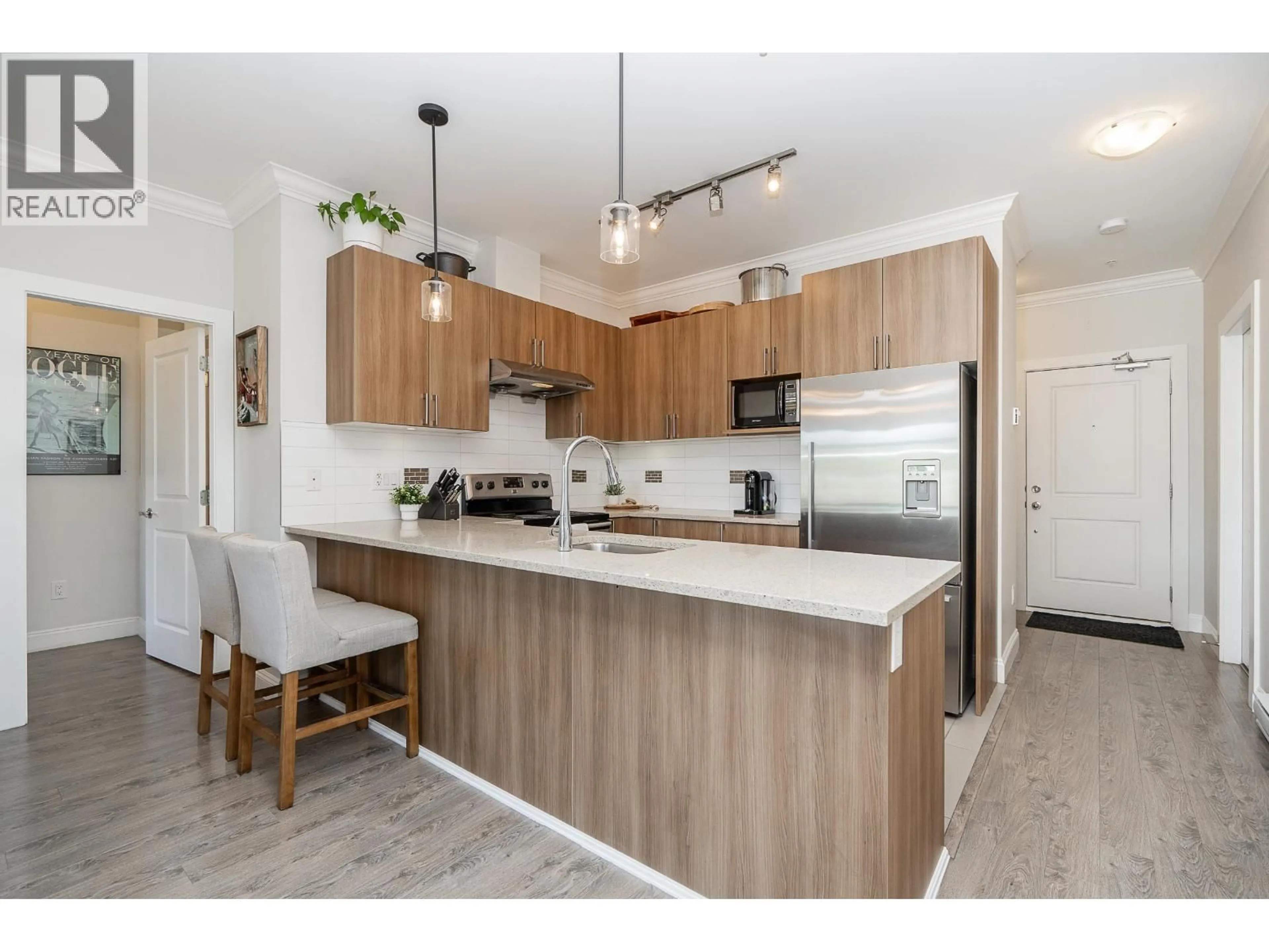 Open concept kitchen, wood/laminate floor for 309 - 11566 224 STREET, Maple Ridge British Columbia V2X5Z7