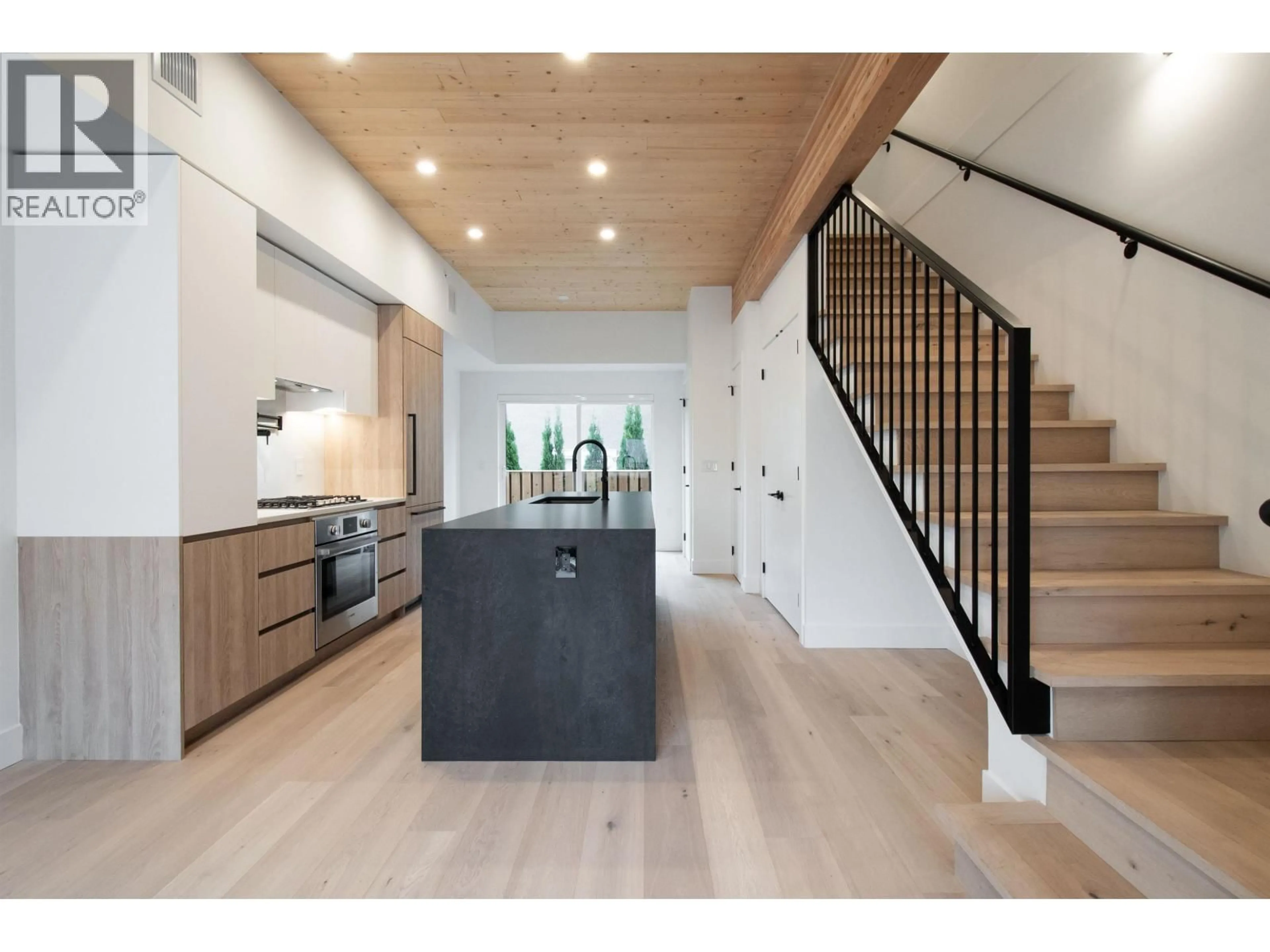 Open concept kitchen, wood/laminate floor for 4170 COLUMBIA STREET, Vancouver British Columbia V5Y2J6