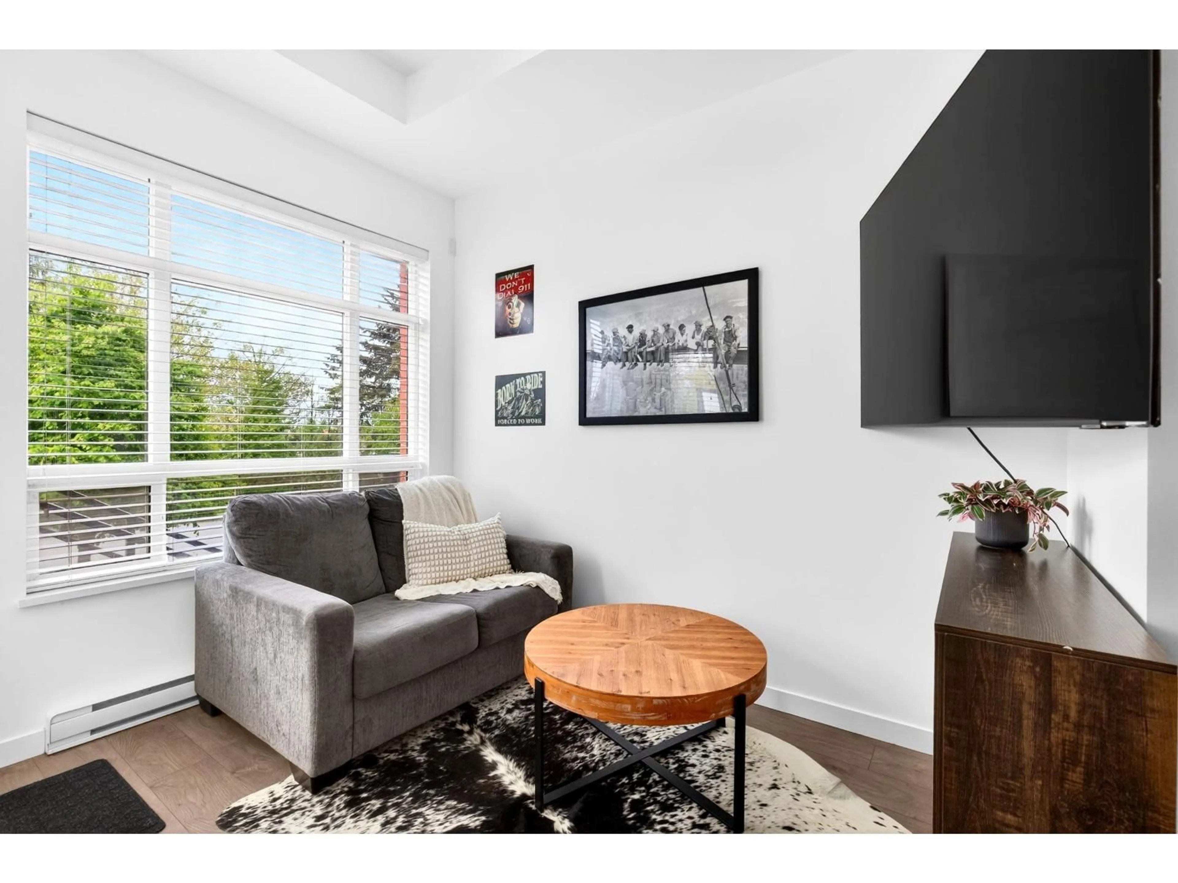 Living room with furniture, wood/laminate floor for F101 - 20211 66 AVENUE, Langley British Columbia V2Y0L4