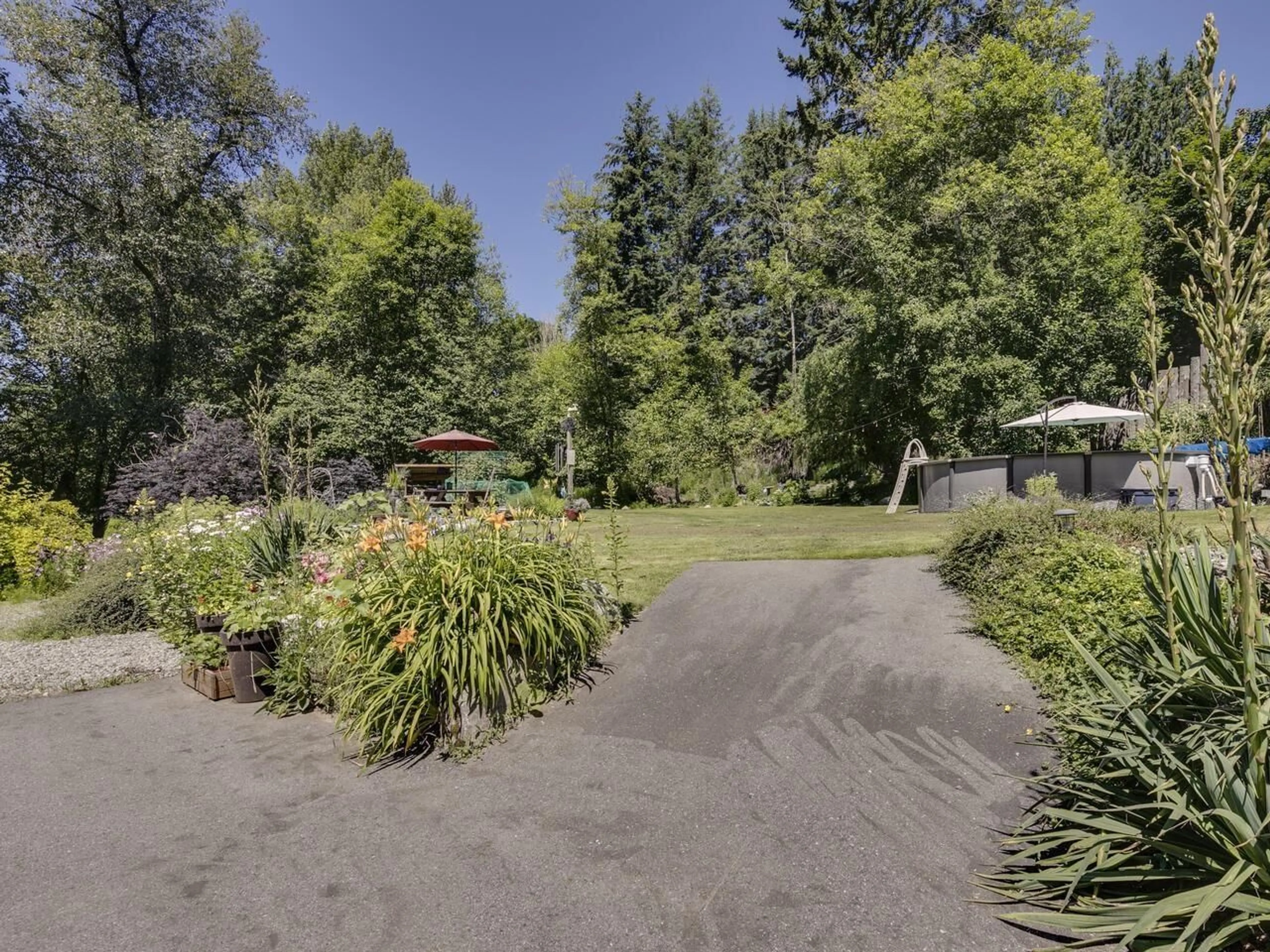 A pic from outside/outdoor area/front of a property/back of a property/a pic from drone, forest/trees view for 7681 HORNE STREET, Mission British Columbia V3V3Y8