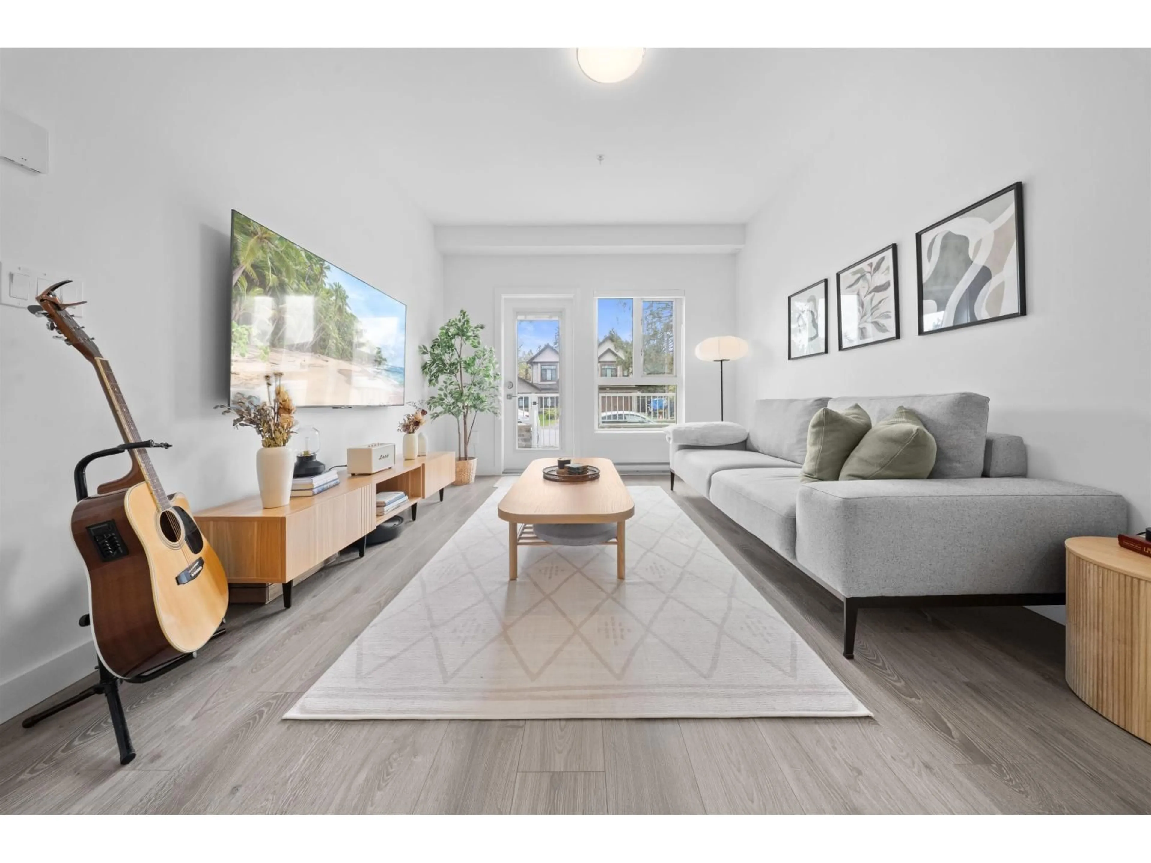 Living room with furniture, wood/laminate floor for 105 - 14225 103A AVENUE, Surrey British Columbia V3T0T4