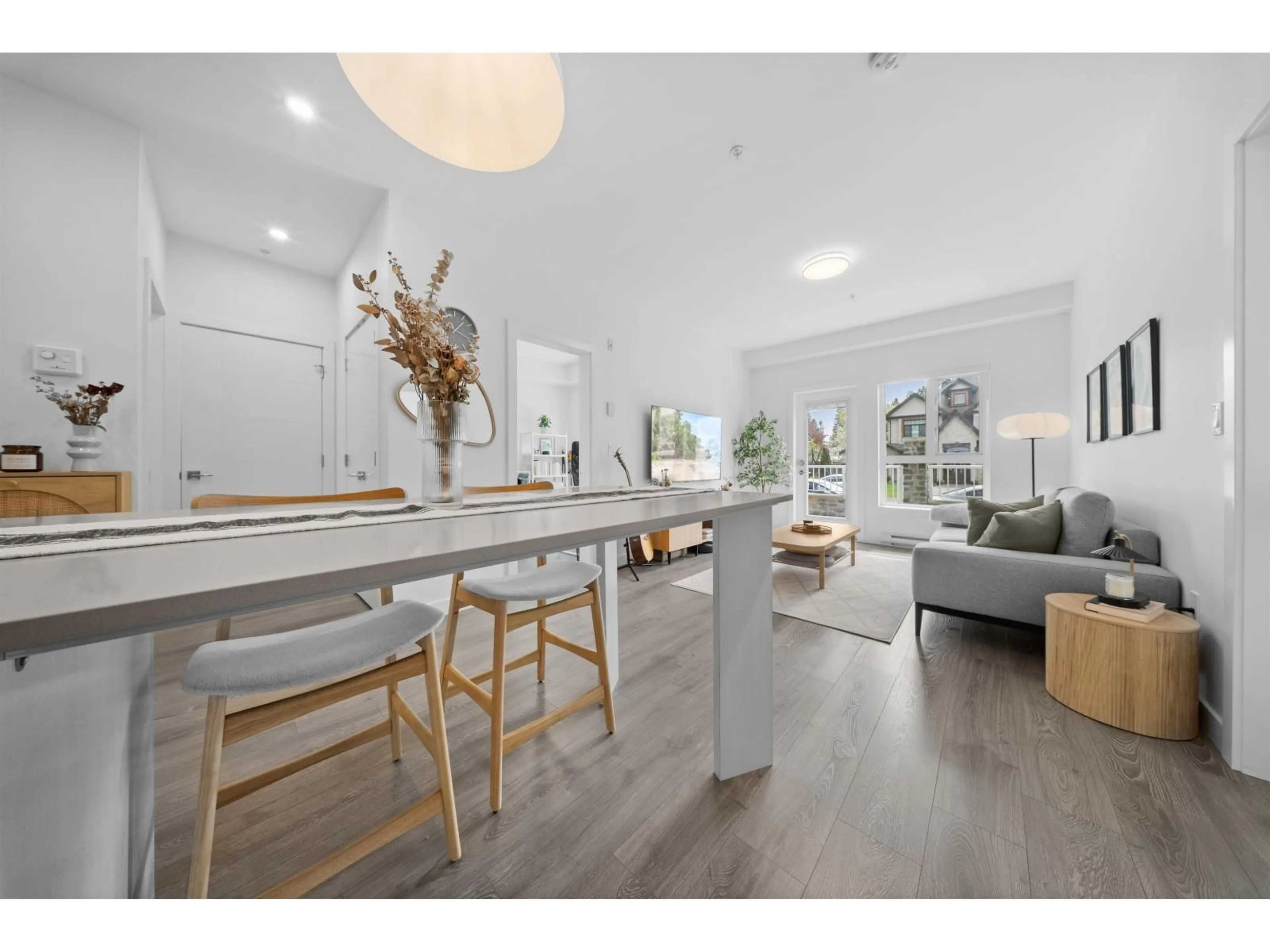 Open concept kitchen, wood/laminate floor for 105 - 14225 103A AVENUE, Surrey British Columbia V3T0T4