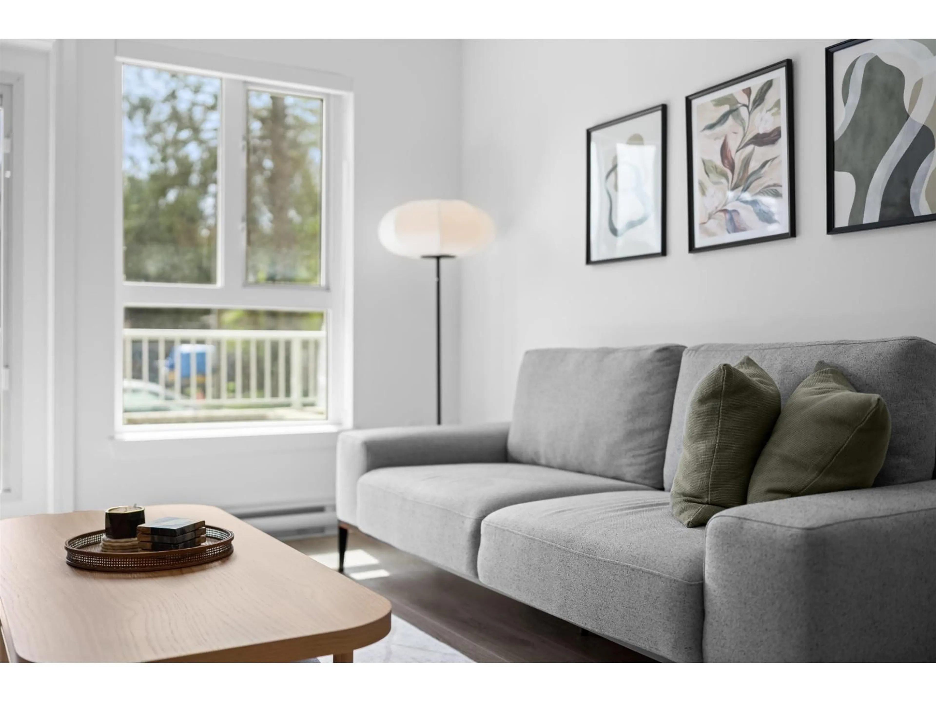 Living room with furniture, wood/laminate floor for 105 - 14225 103A AVENUE, Surrey British Columbia V3T0T4