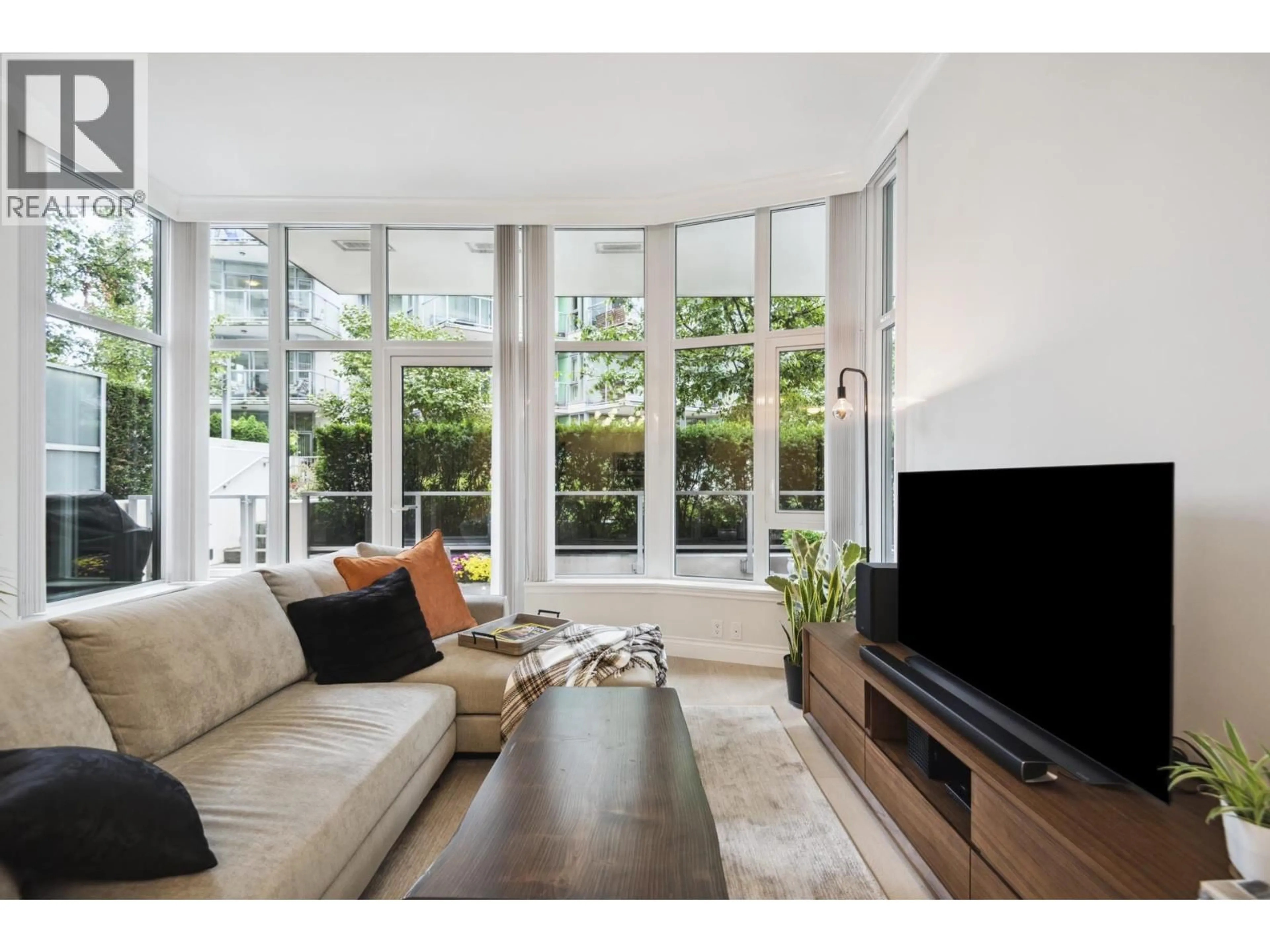 Living room with furniture, unknown for 112 - 185 VICTORY SHIP WAY, North Vancouver British Columbia V7L0G2