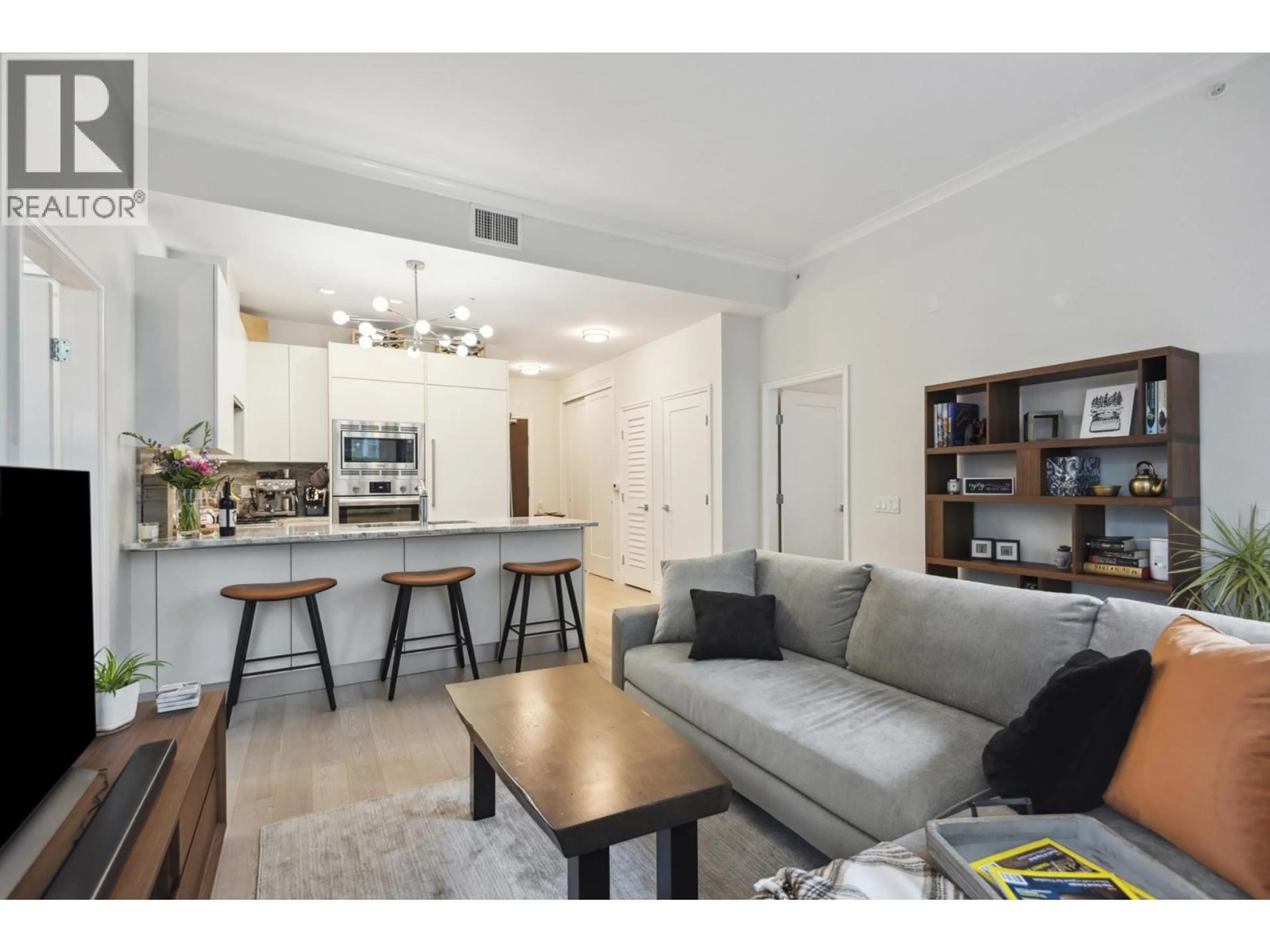 Living room with furniture, unknown for 112 - 185 VICTORY SHIP WAY, North Vancouver British Columbia V7L0G2