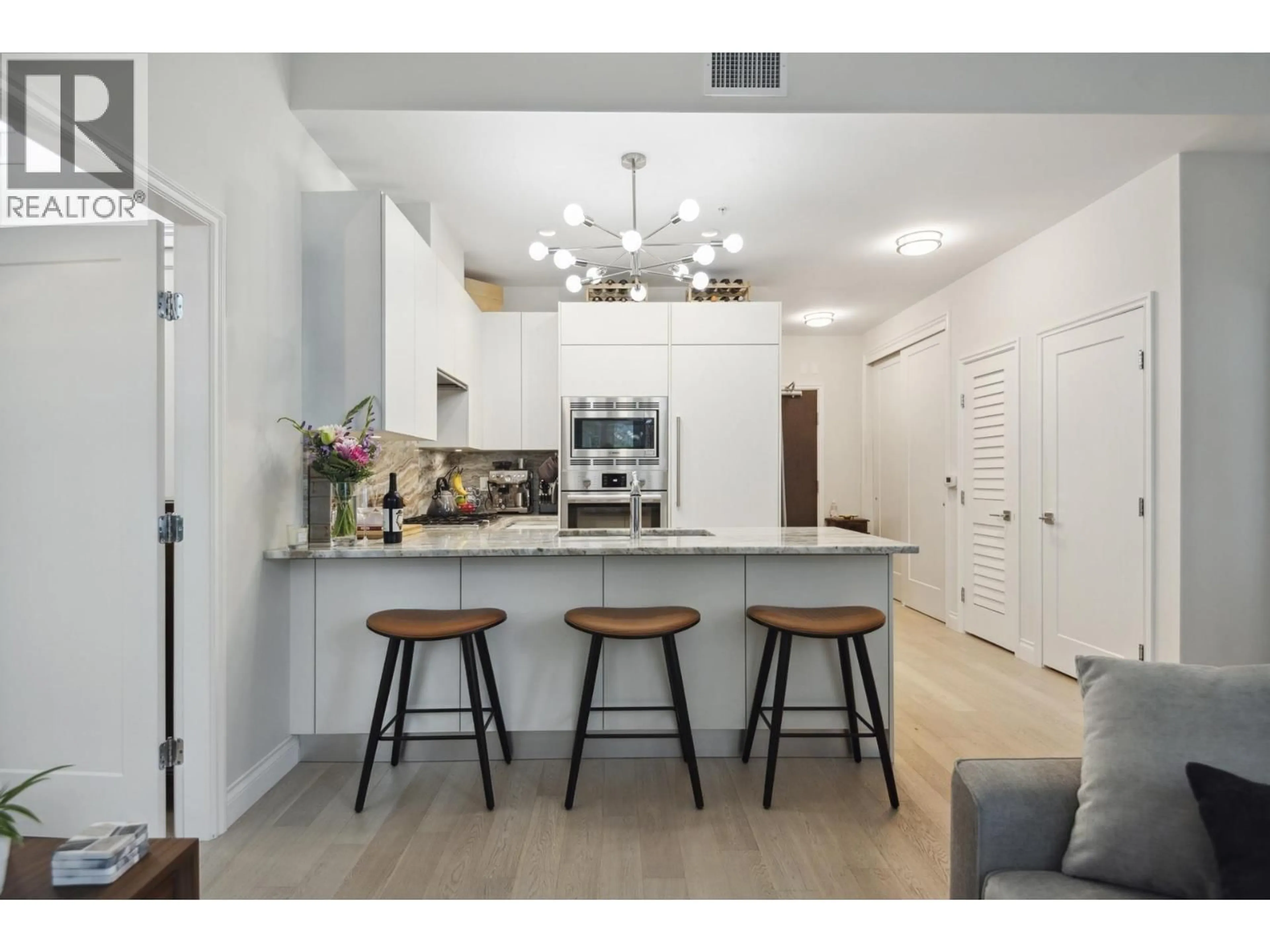 Open concept kitchen, unknown for 112 - 185 VICTORY SHIP WAY, North Vancouver British Columbia V7L0G2