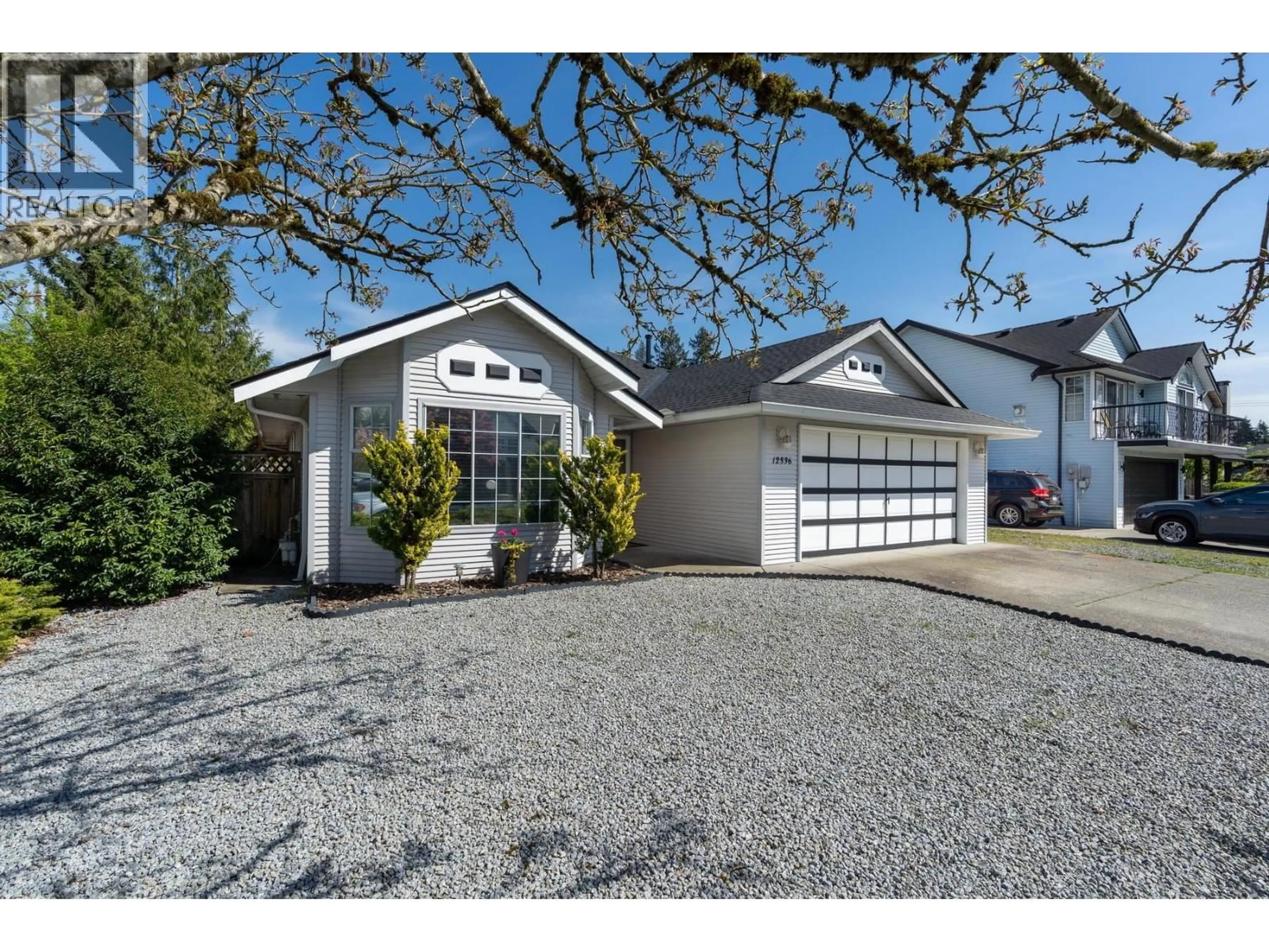 Home with vinyl exterior material, street for 12336 NIKOLA STREET, Pitt Meadows British Columbia V3Y2K9