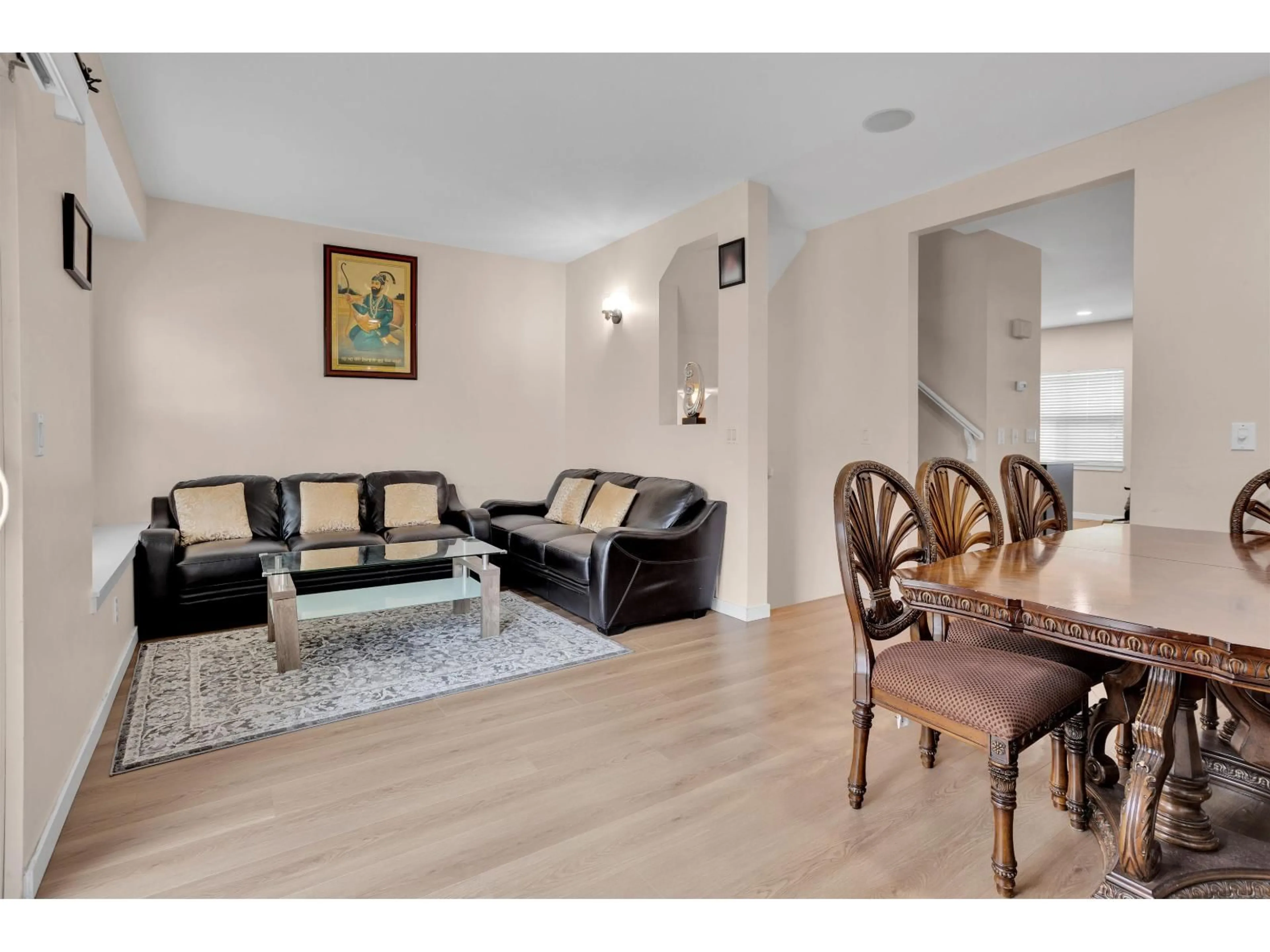 Living room with furniture, wood/laminate floor for 3 - 12677 63 AVENUE, Surrey British Columbia V3X3T3