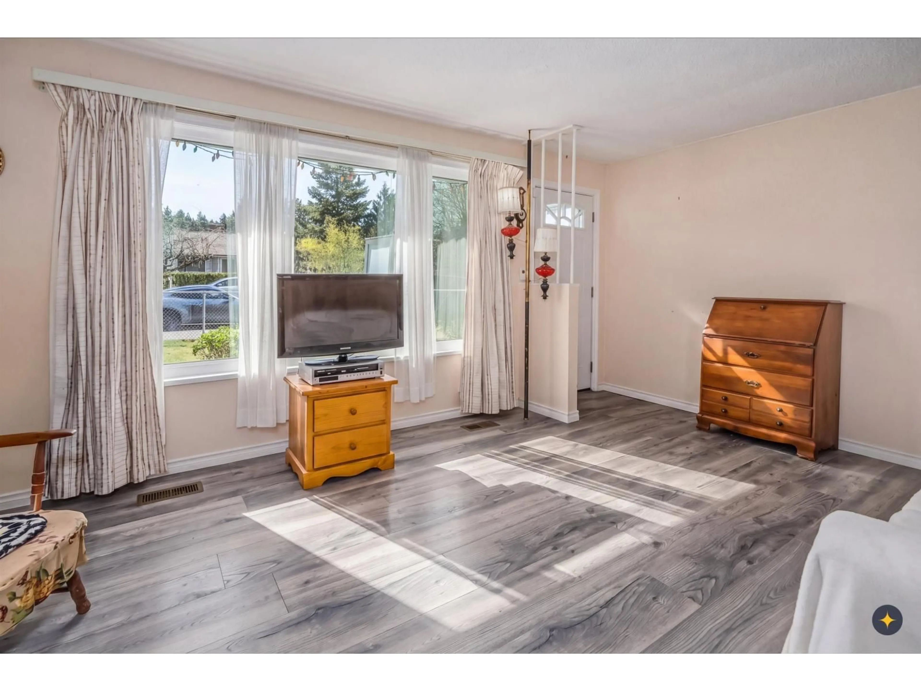Living room with furniture, wood/laminate floor for 10079 143 STREET, Surrey British Columbia V3T4S9