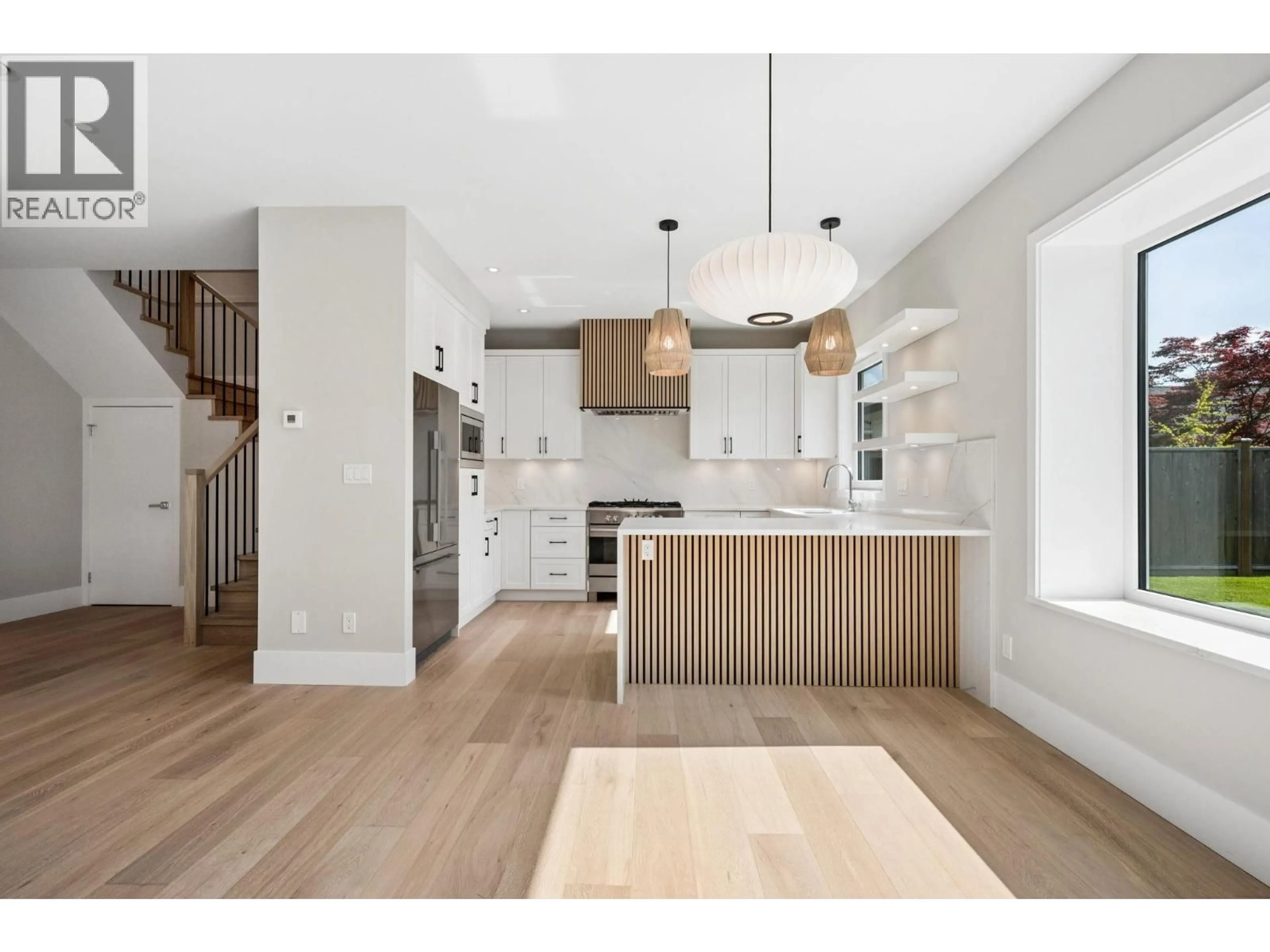 Open concept kitchen, wood/laminate floor for 5198 WESTMINSTER AVENUE, Delta British Columbia V4K2J2