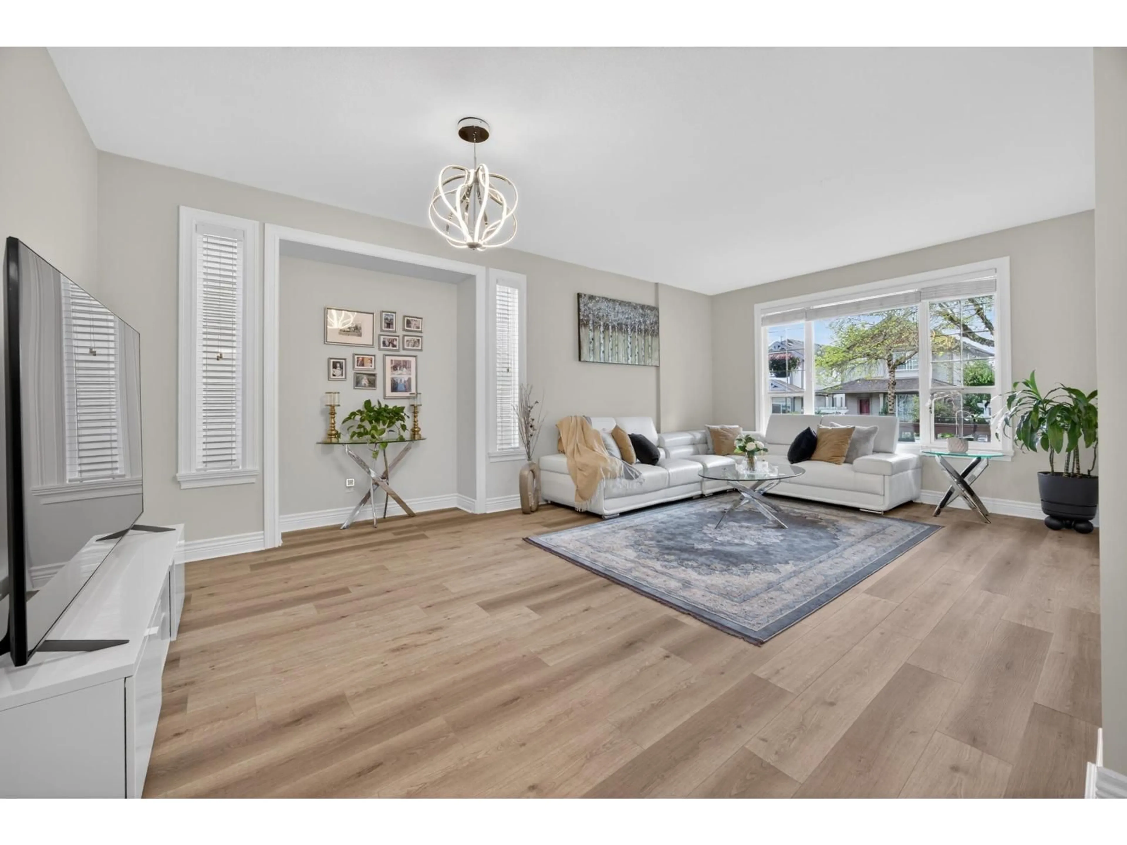 Living room with furniture, wood/laminate floor for 19485 66A AVENUE, Surrey British Columbia V4N0C3