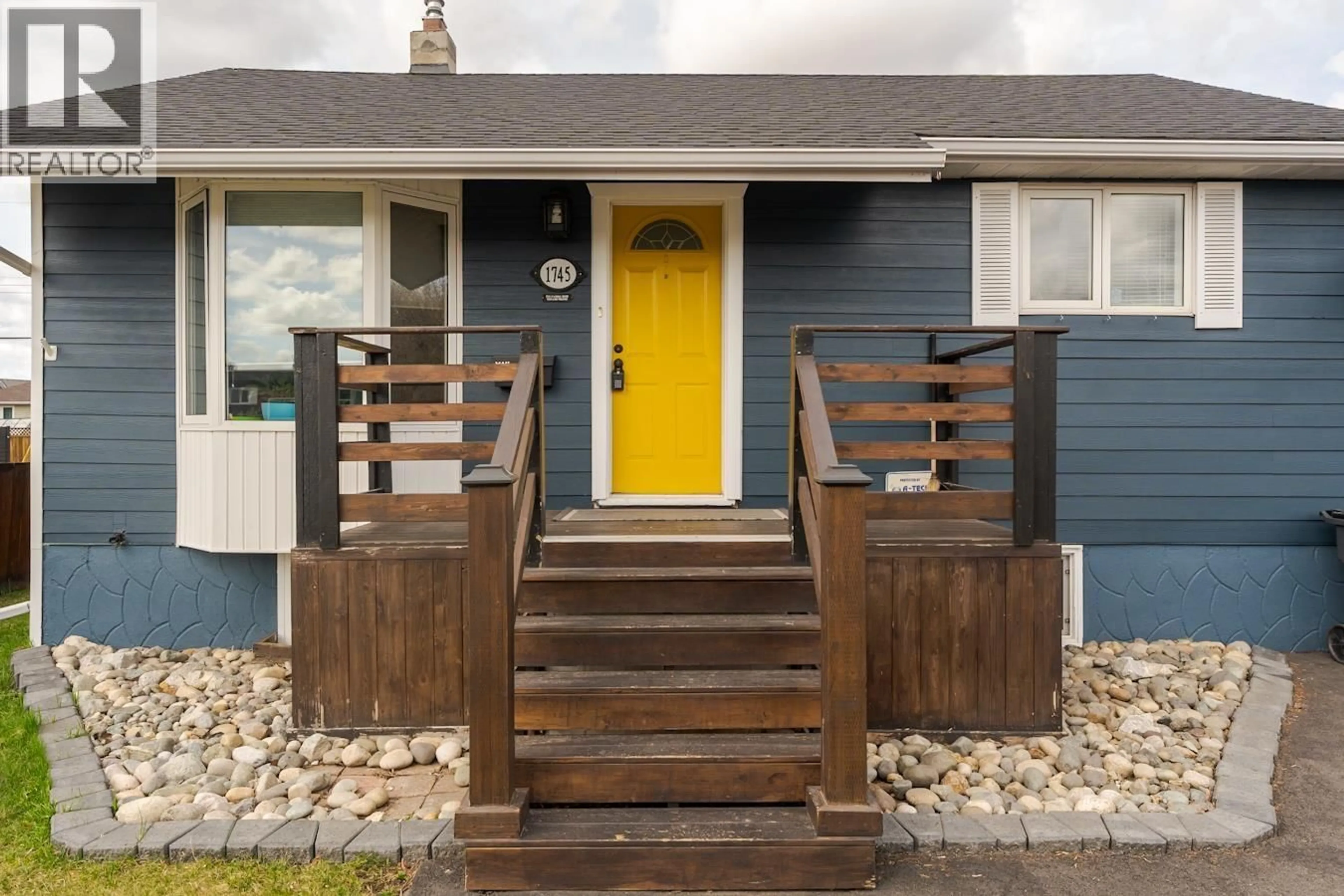 Home with vinyl exterior material, street for 1745 NORWOOD STREET, Prince George British Columbia V2L1X7