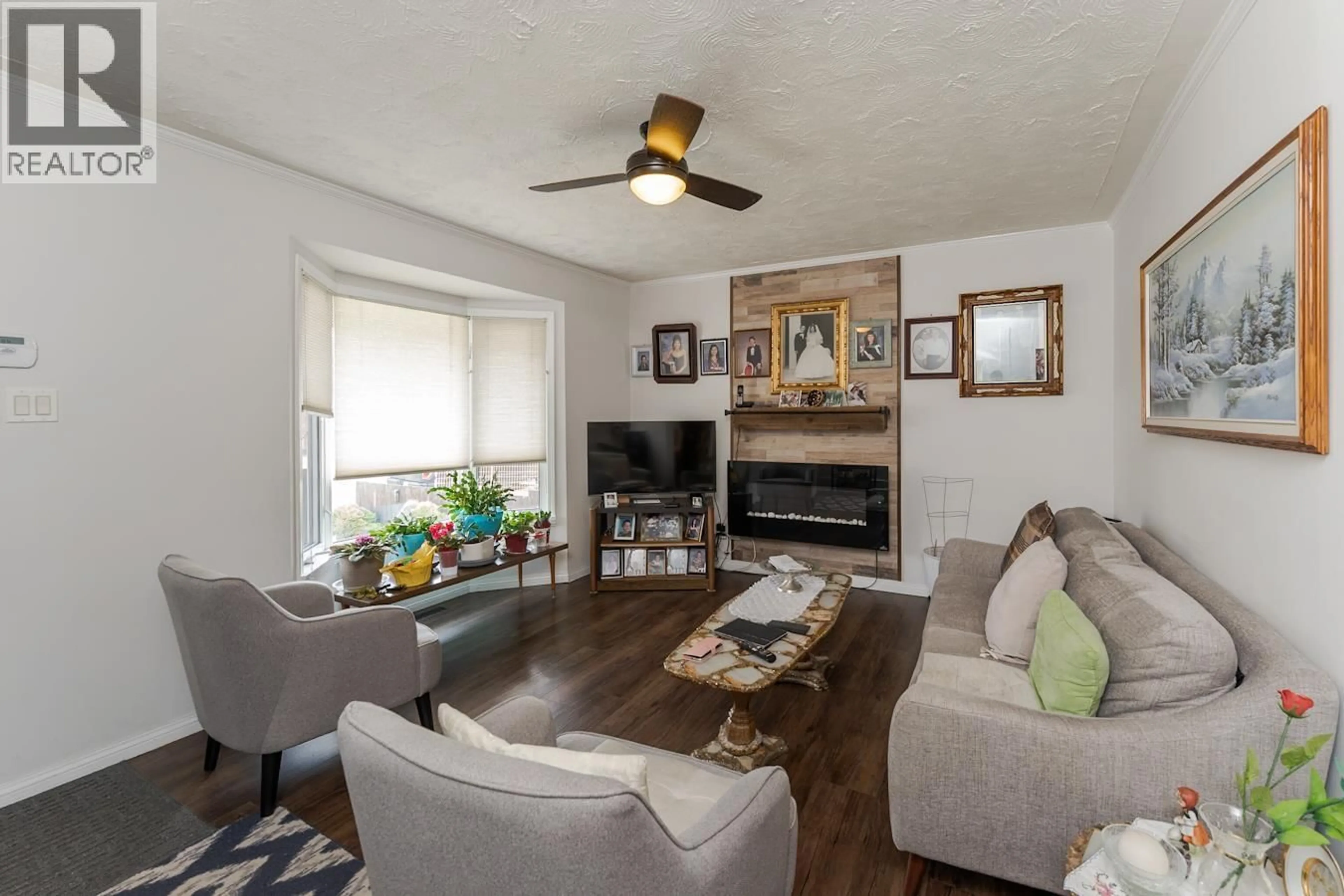 Living room with furniture, wood/laminate floor for 1745 NORWOOD STREET, Prince George British Columbia V2L1X7