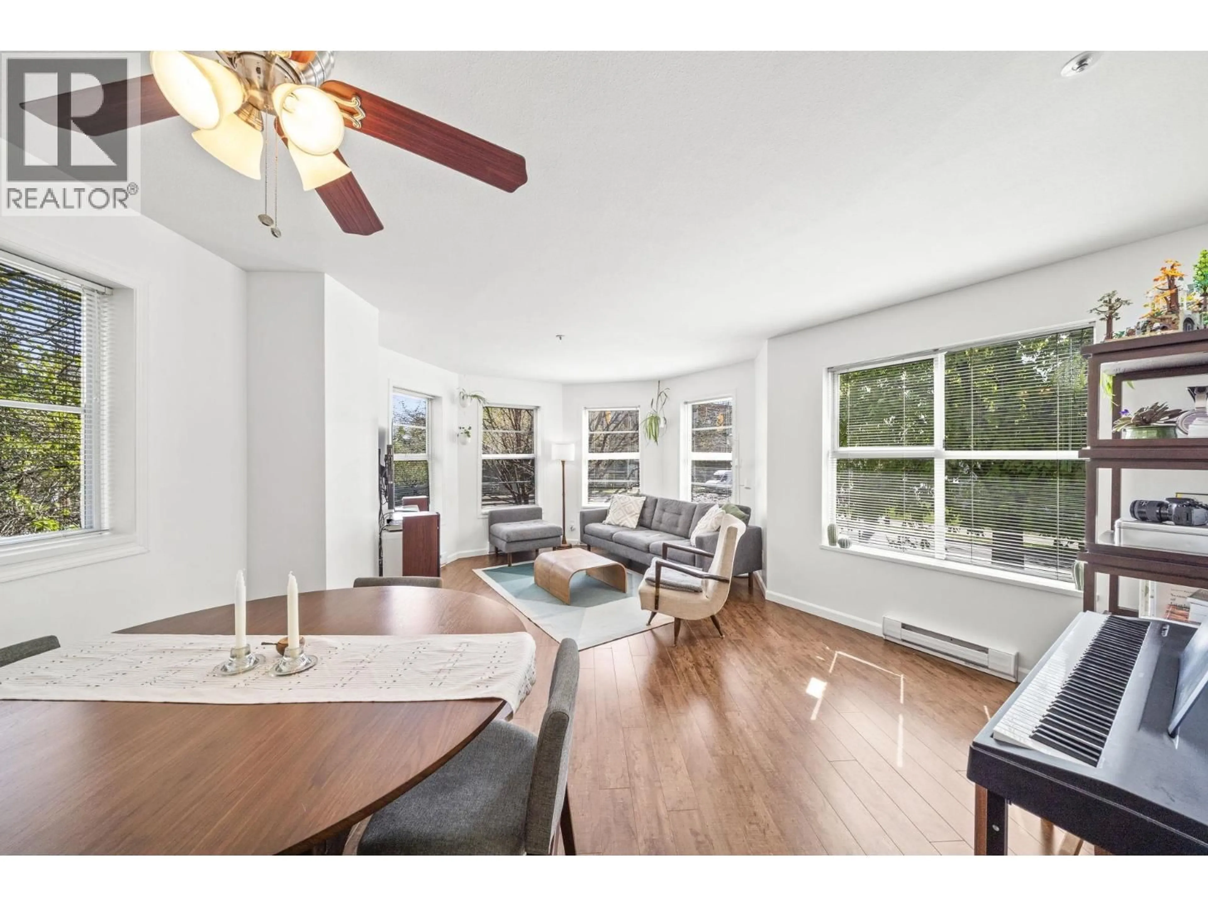 Living room with furniture, wood/laminate floor for 204 - 1883 10TH AVENUE, Vancouver British Columbia V5N1X8
