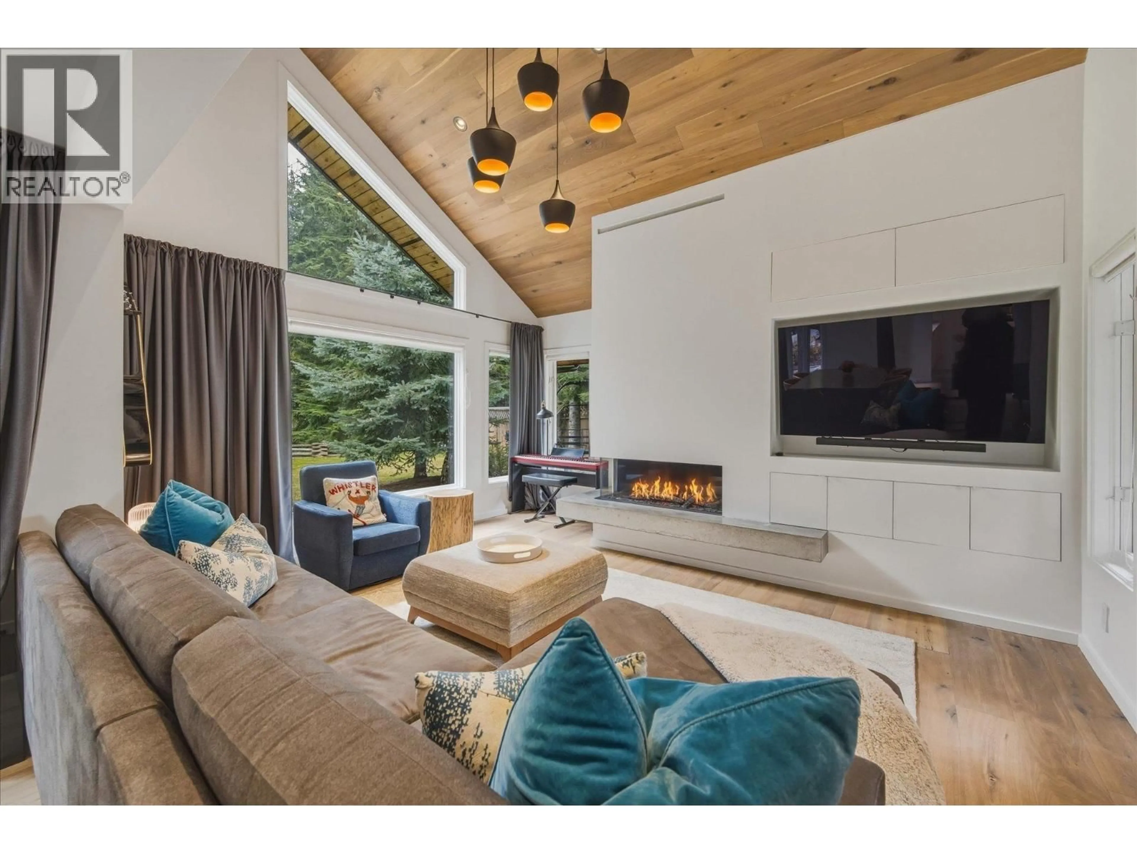 Living room with furniture, wood/laminate floor for 6232 OBOE PLACE, Whistler British Columbia V8E0C5