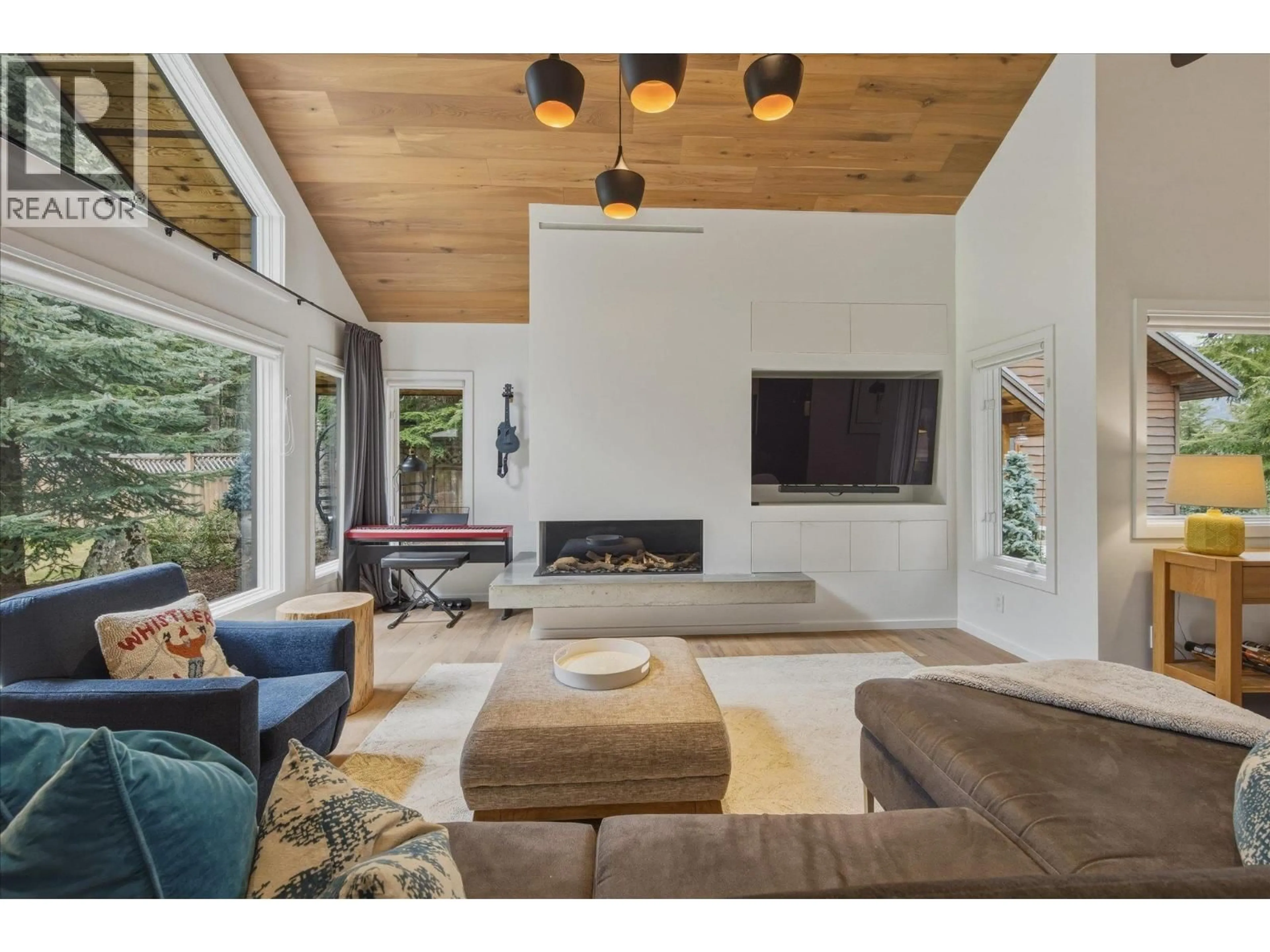 Living room with furniture, wood/laminate floor for 6232 OBOE PLACE, Whistler British Columbia V8E0C5