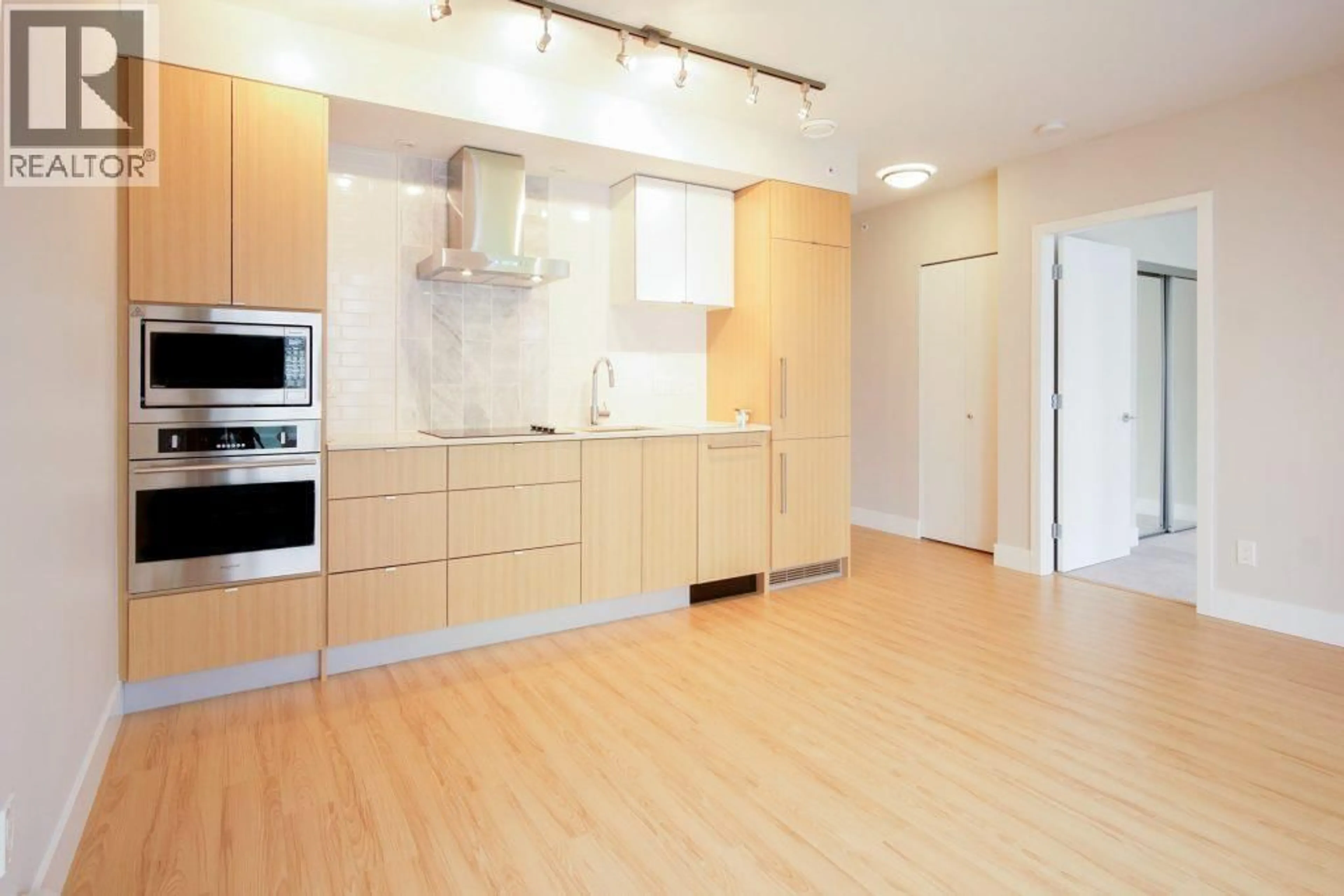 Open concept kitchen, wood/laminate floor for 606 - 159 2ND AVENUE, Vancouver British Columbia V5Y0L8