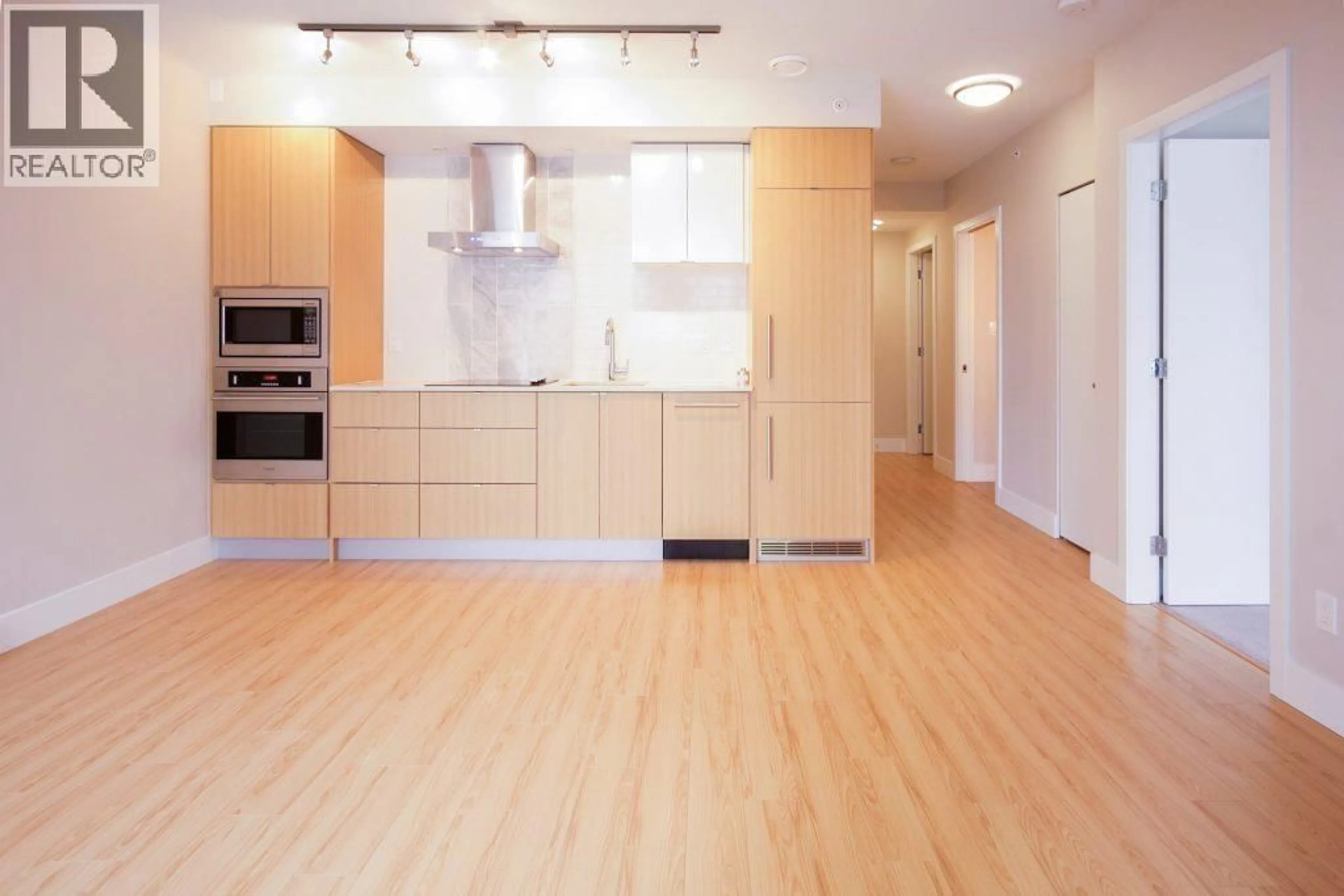 Open concept kitchen, wood/laminate floor for 606 - 159 2ND AVENUE, Vancouver British Columbia V5Y0L8