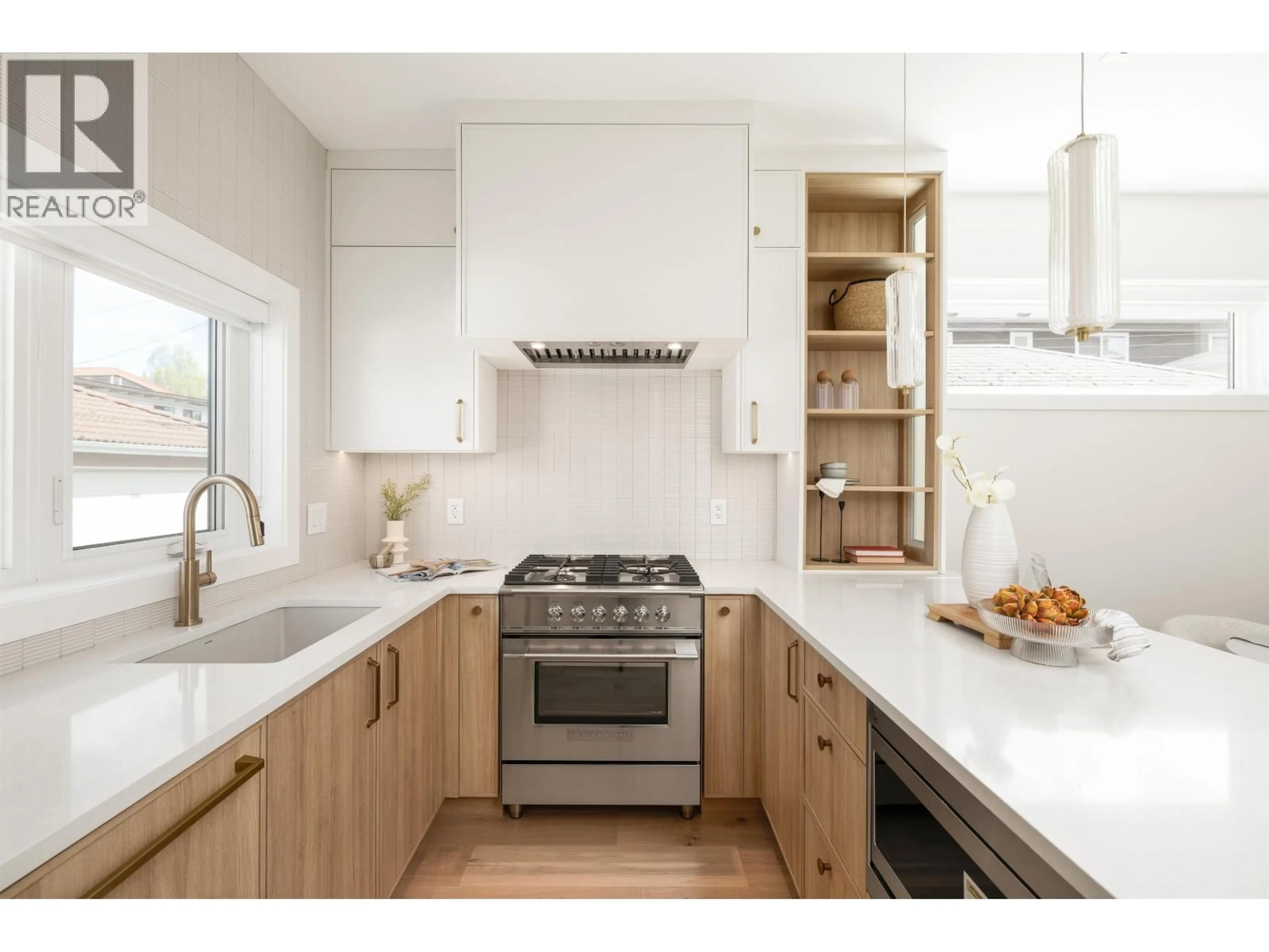 Contemporary kitchen, wood/laminate floor for 3143 19 AVENUE, Vancouver British Columbia V5M2T2