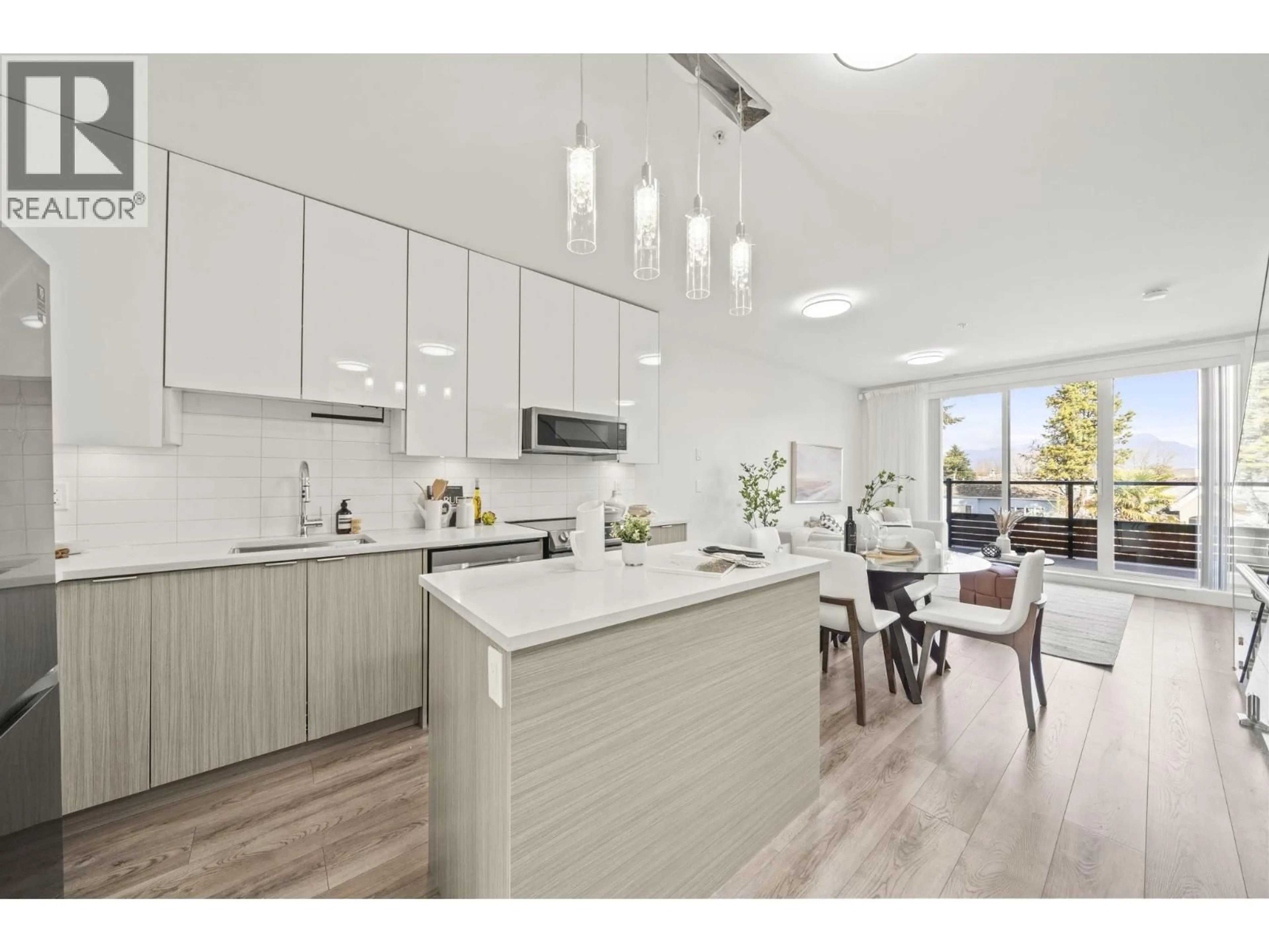 Open concept kitchen, wood/laminate floor for 2296 33RD AVENUE, Vancouver British Columbia V5N3G1
