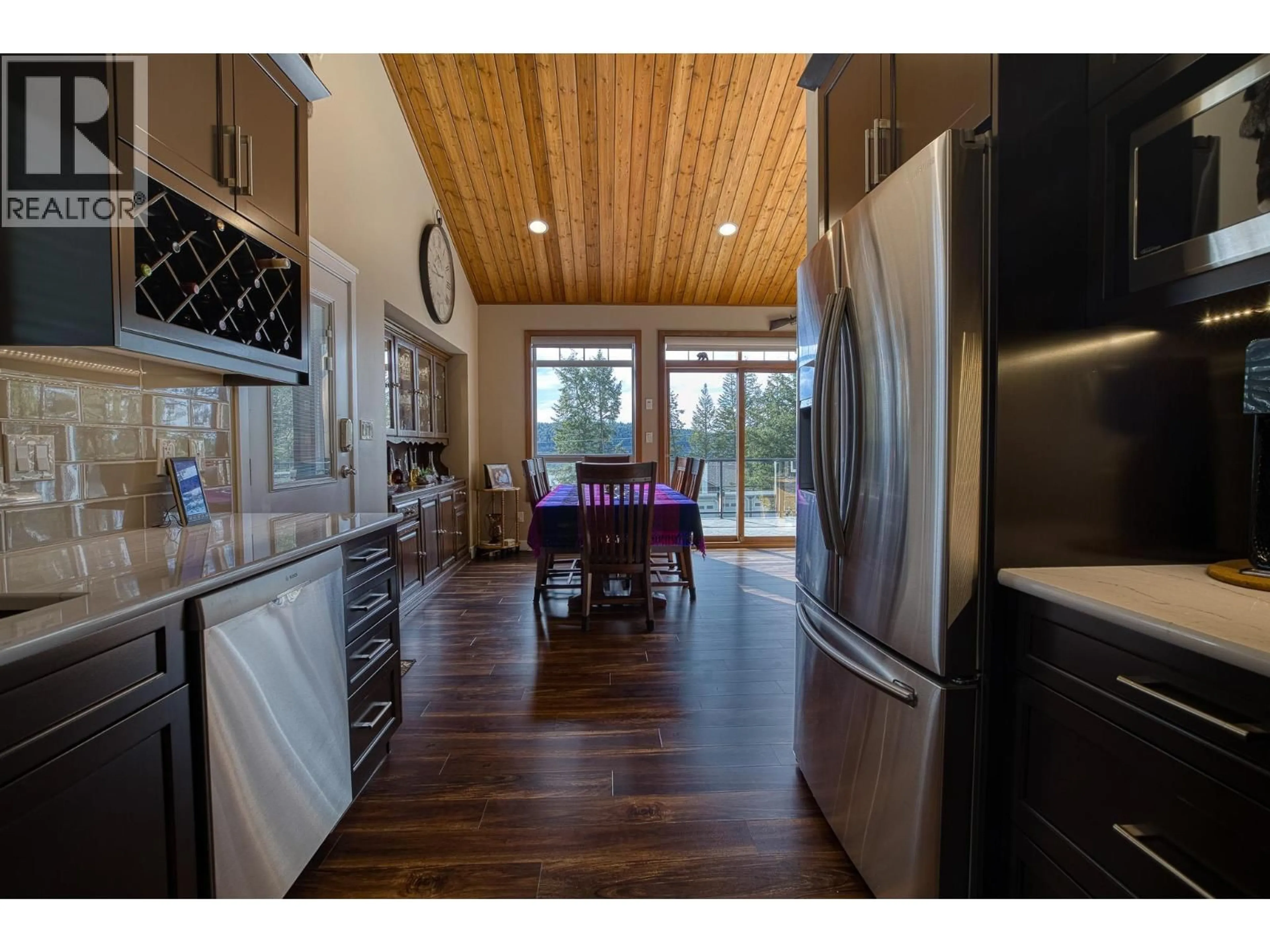 Open concept kitchen, wood/laminate floor for 3779 EMERALD CRESCENT, Lac La Hache British Columbia V0K1T1