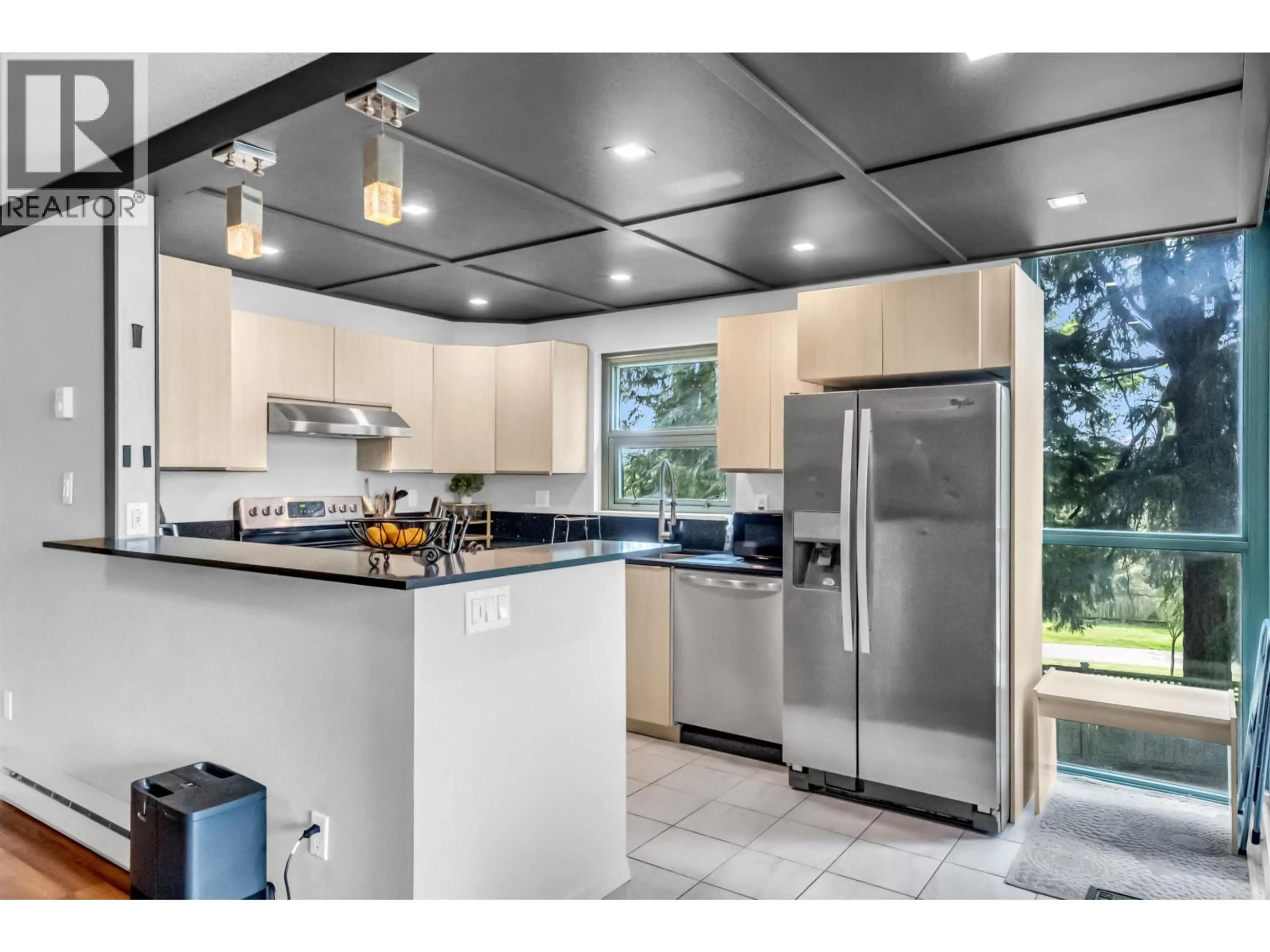 Open concept kitchen, ceramic/tile floor for 220 - 7288 ACORN AVENUE, Burnaby British Columbia V5E4H6