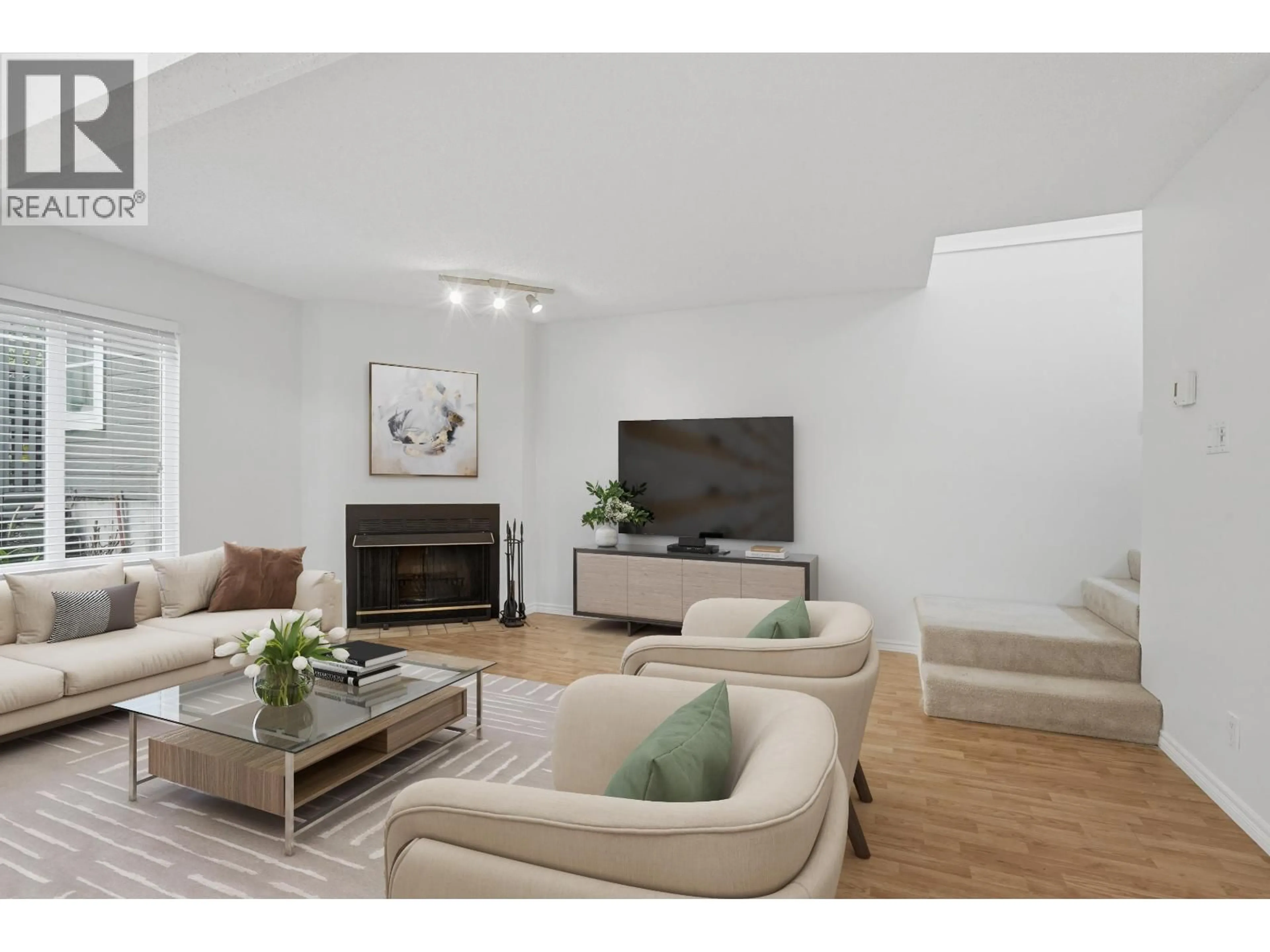 Living room with furniture, wood/laminate floor for 3407 LYNMOOR PLACE, Vancouver British Columbia V5S4G4