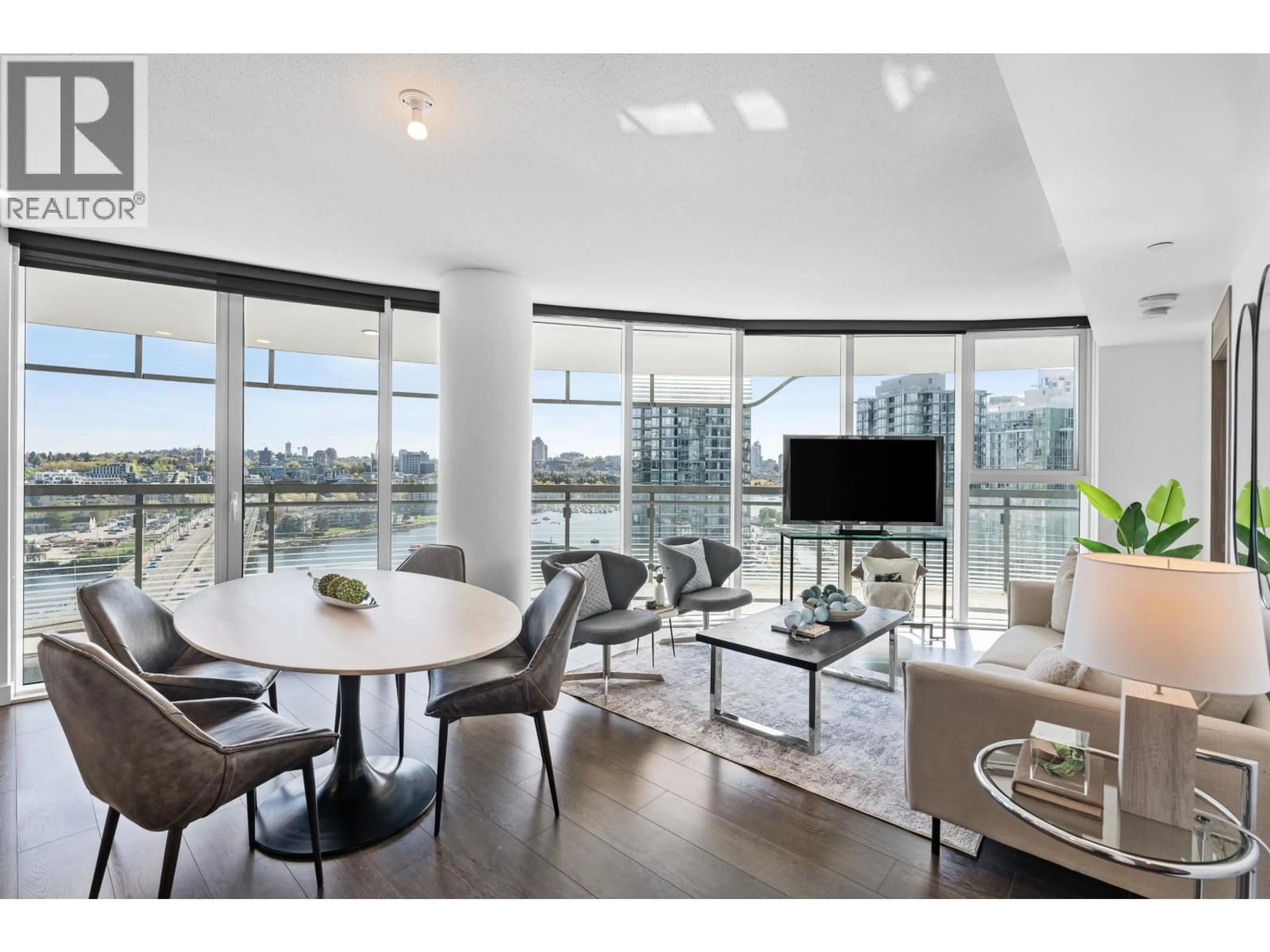 Living room with furniture, wood/laminate floor for 1584 - 87 NELSON STREET, Vancouver British Columbia V6Z0E8