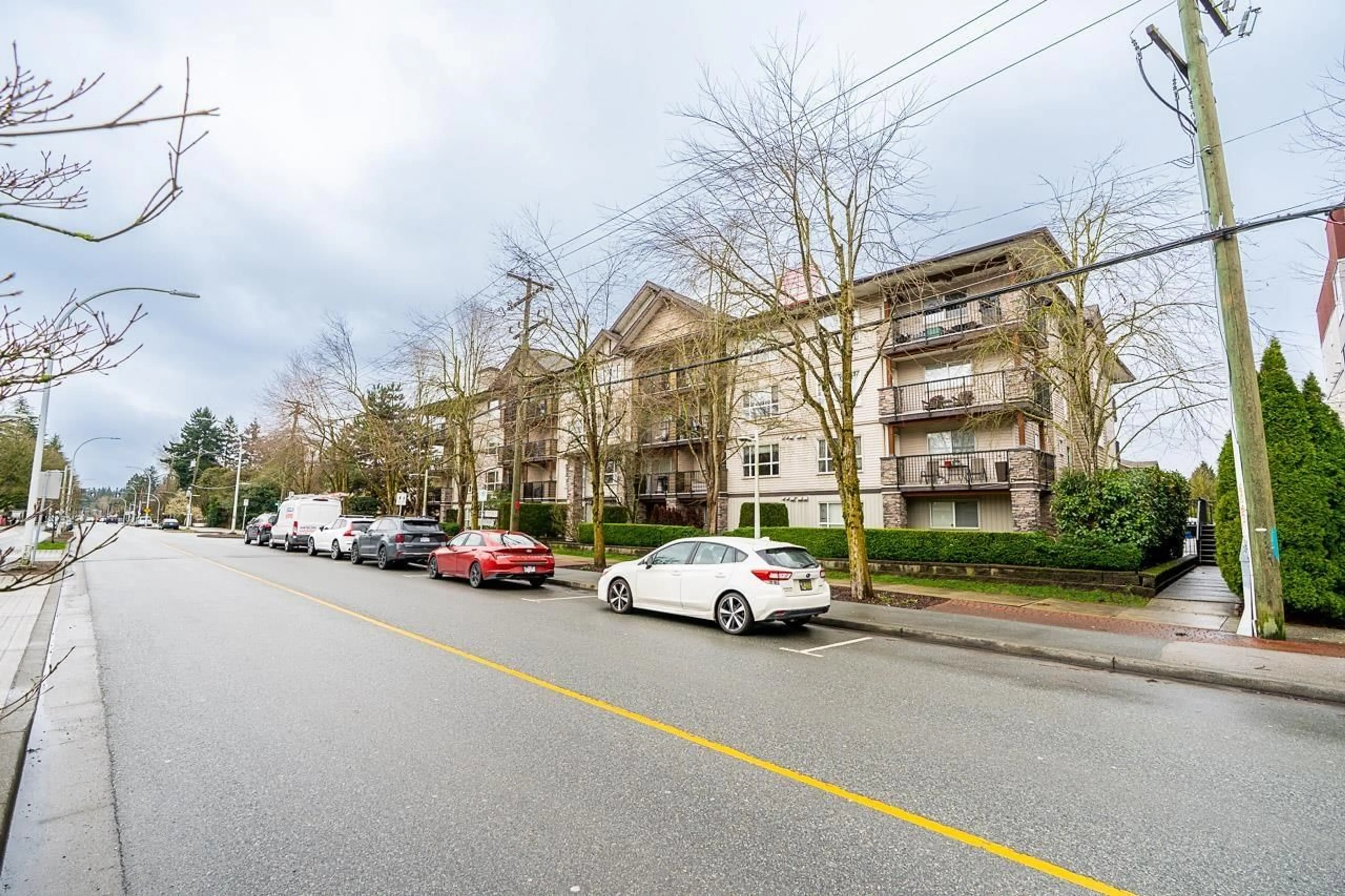 A pic from outside/outdoor area/front of a property/back of a property/a pic from drone, street for 313 - 5465 203 STREET, Langley British Columbia V3A9L8