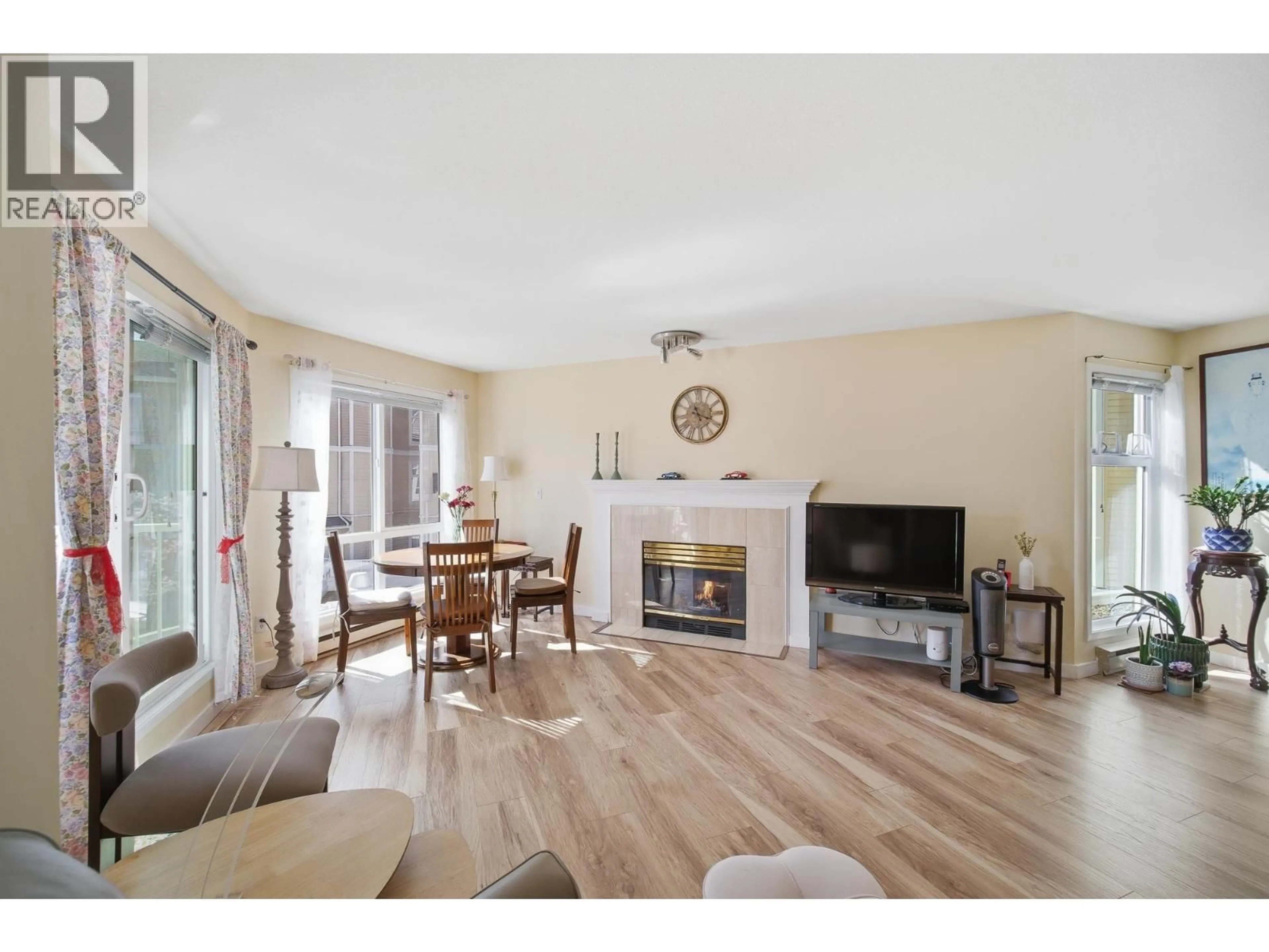 Living room with furniture, wood/laminate floor for 212 - 7437 MOFFATT ROAD, Richmond British Columbia V6Y1X9
