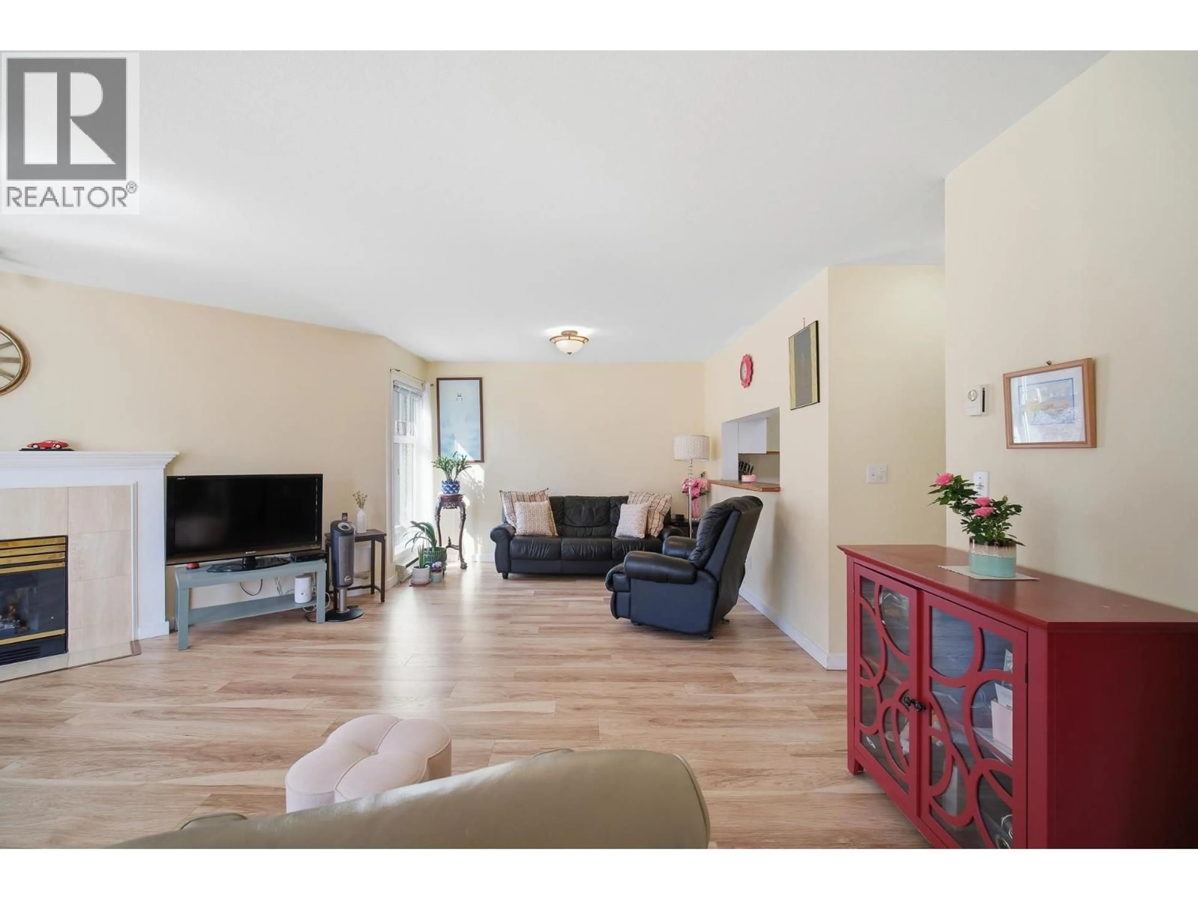 Living room with furniture, wood/laminate floor for 212 - 7437 MOFFATT ROAD, Richmond British Columbia V6Y1X9