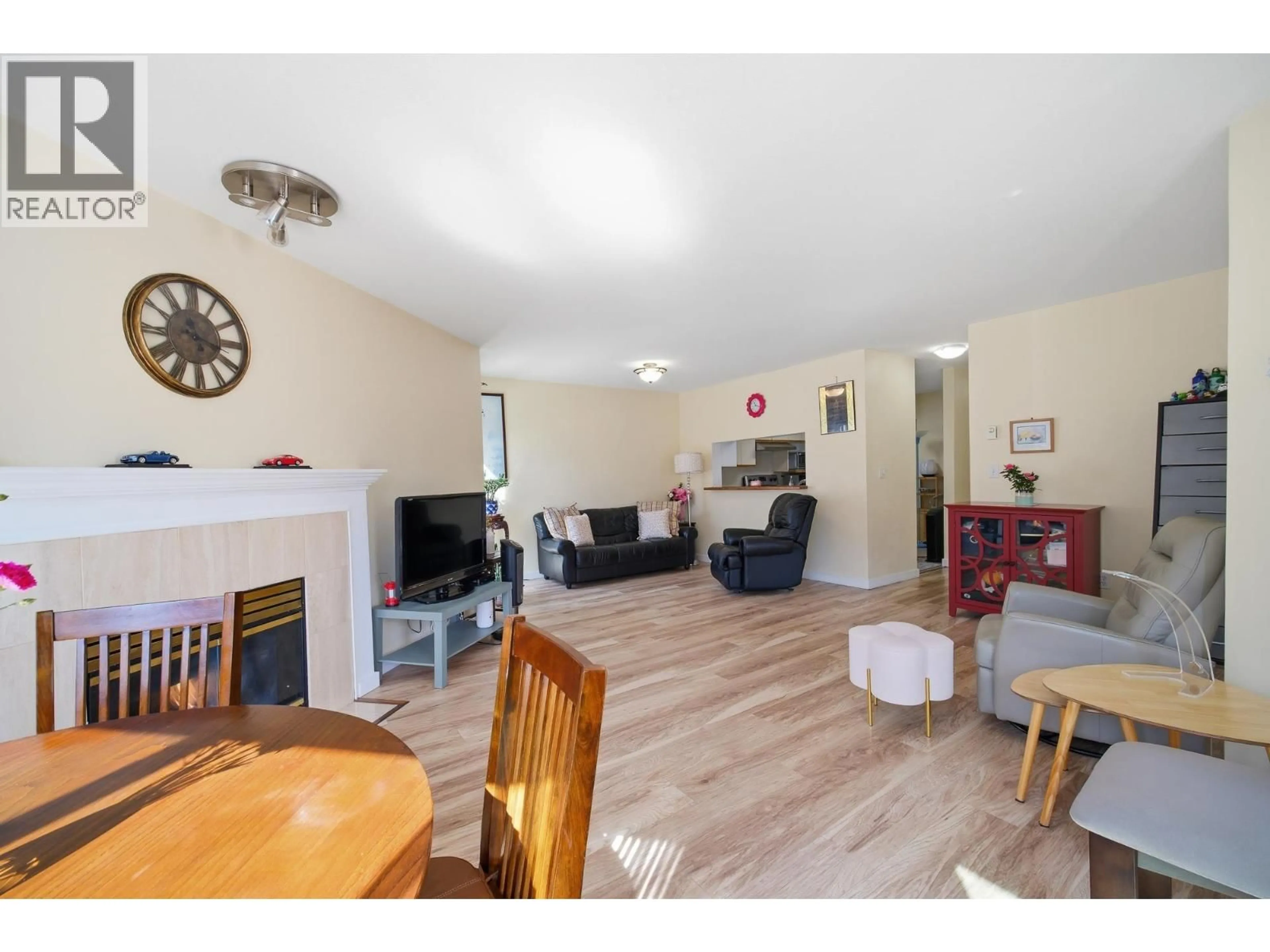 Living room with furniture, wood/laminate floor for 212 - 7437 MOFFATT ROAD, Richmond British Columbia V6Y1X9