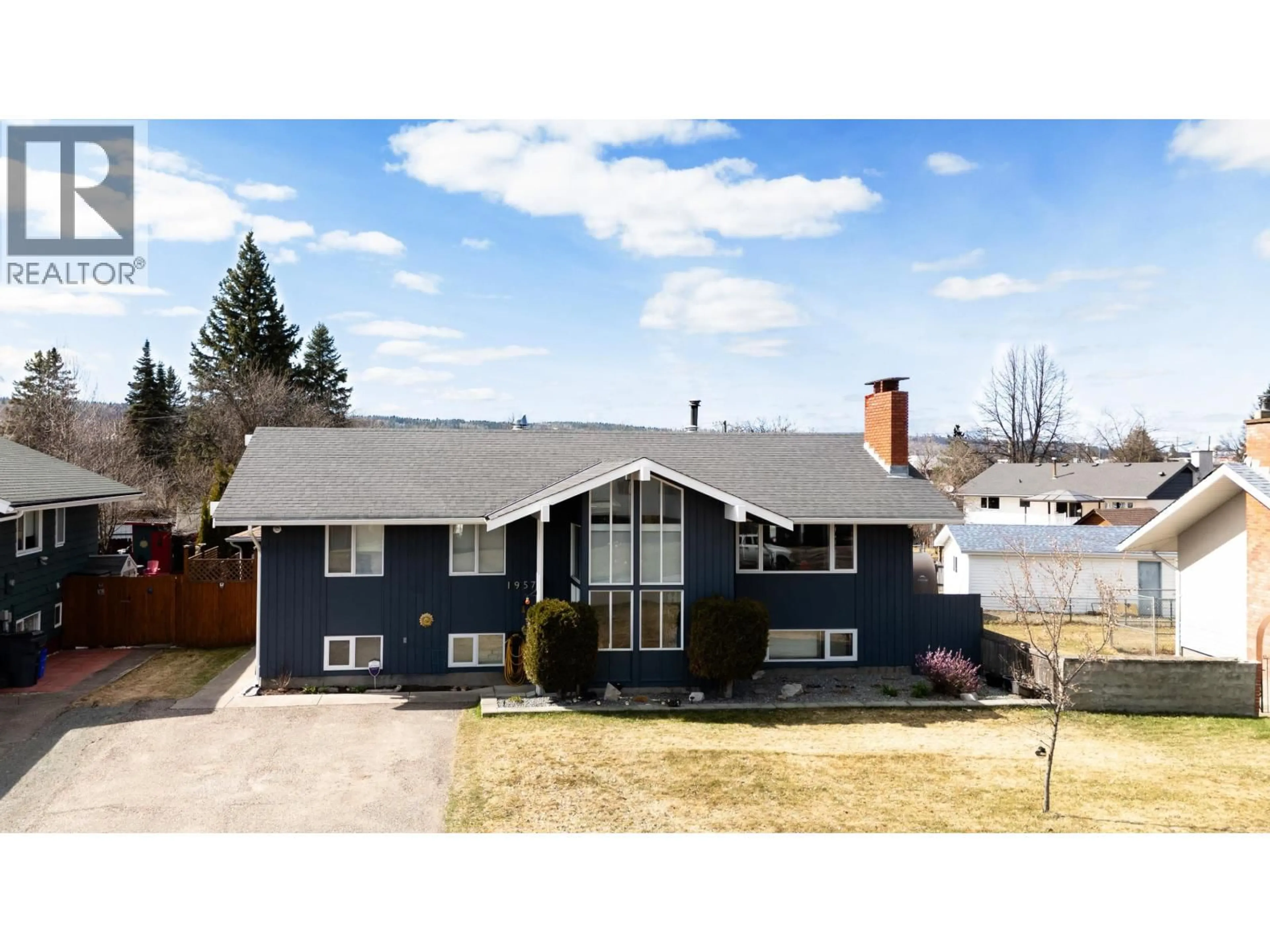 Home with vinyl exterior material, street for 1957 HARPER DRIVE, Prince George British Columbia V2M2Z3