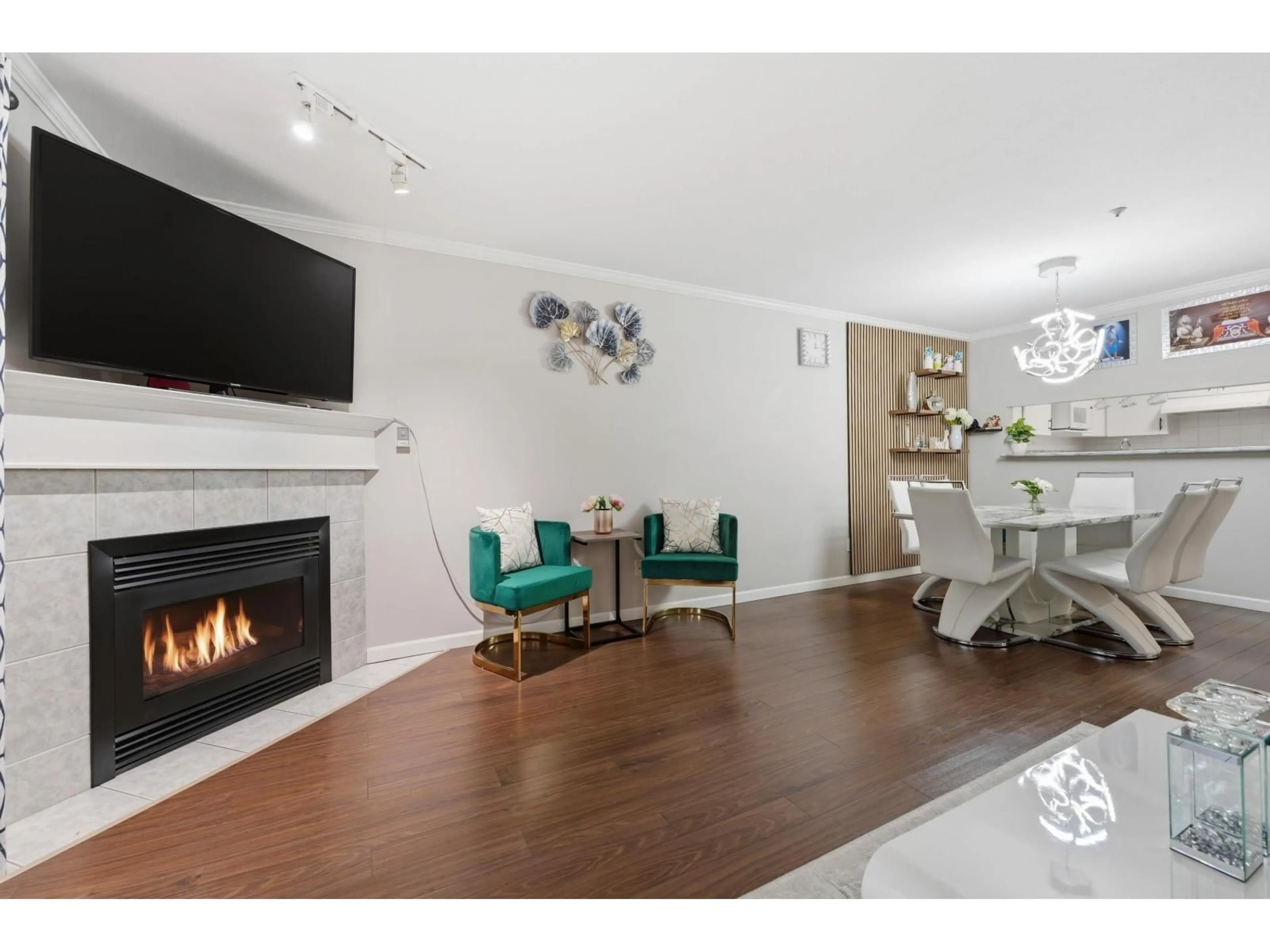 Living room with furniture, wood/laminate floor for 214 - 10128 132 STREET, Surrey British Columbia V3T3T5