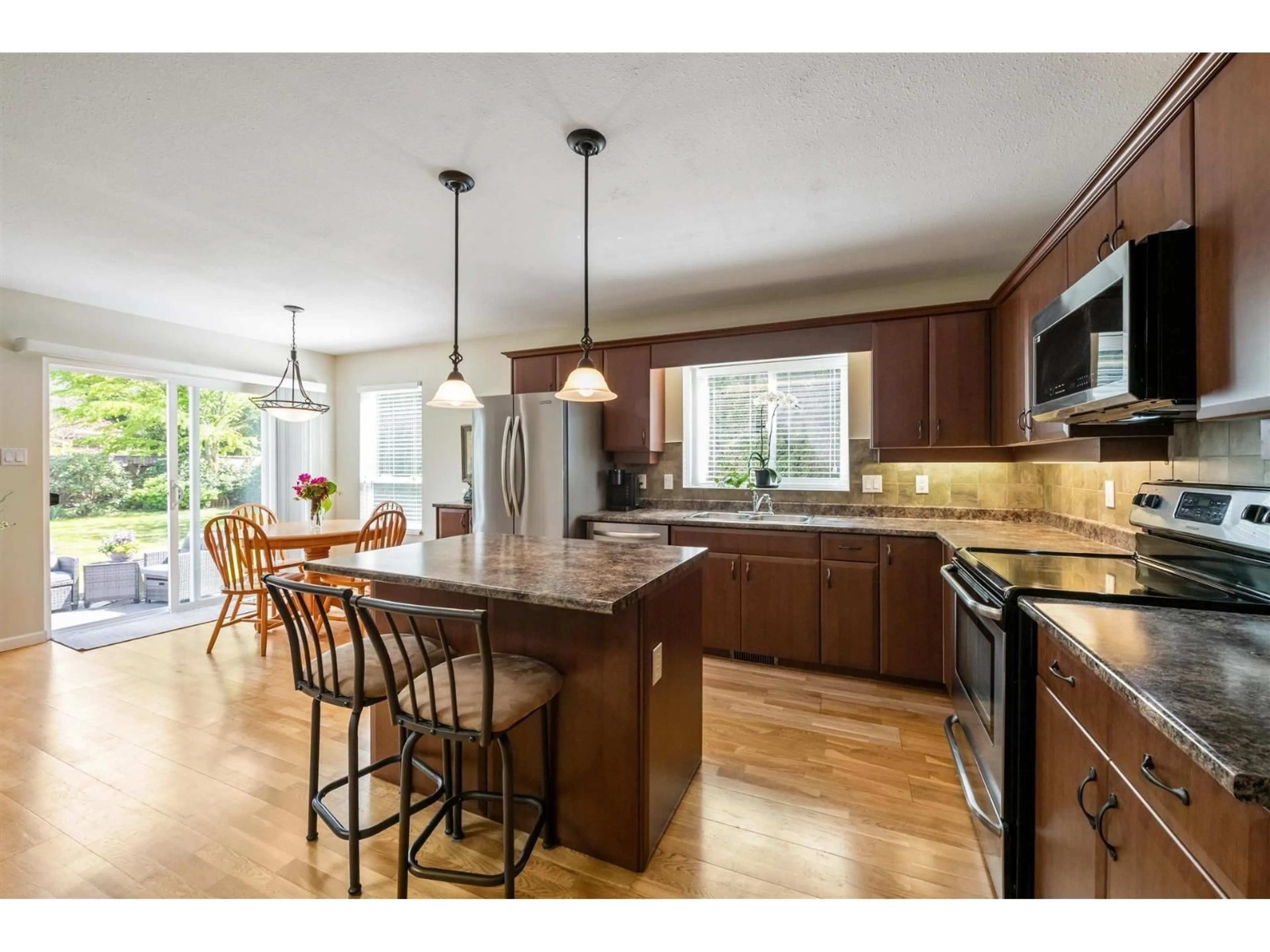 Open concept kitchen, wood/laminate floor for 2436 126 STREET, Surrey British Columbia V4A8H7