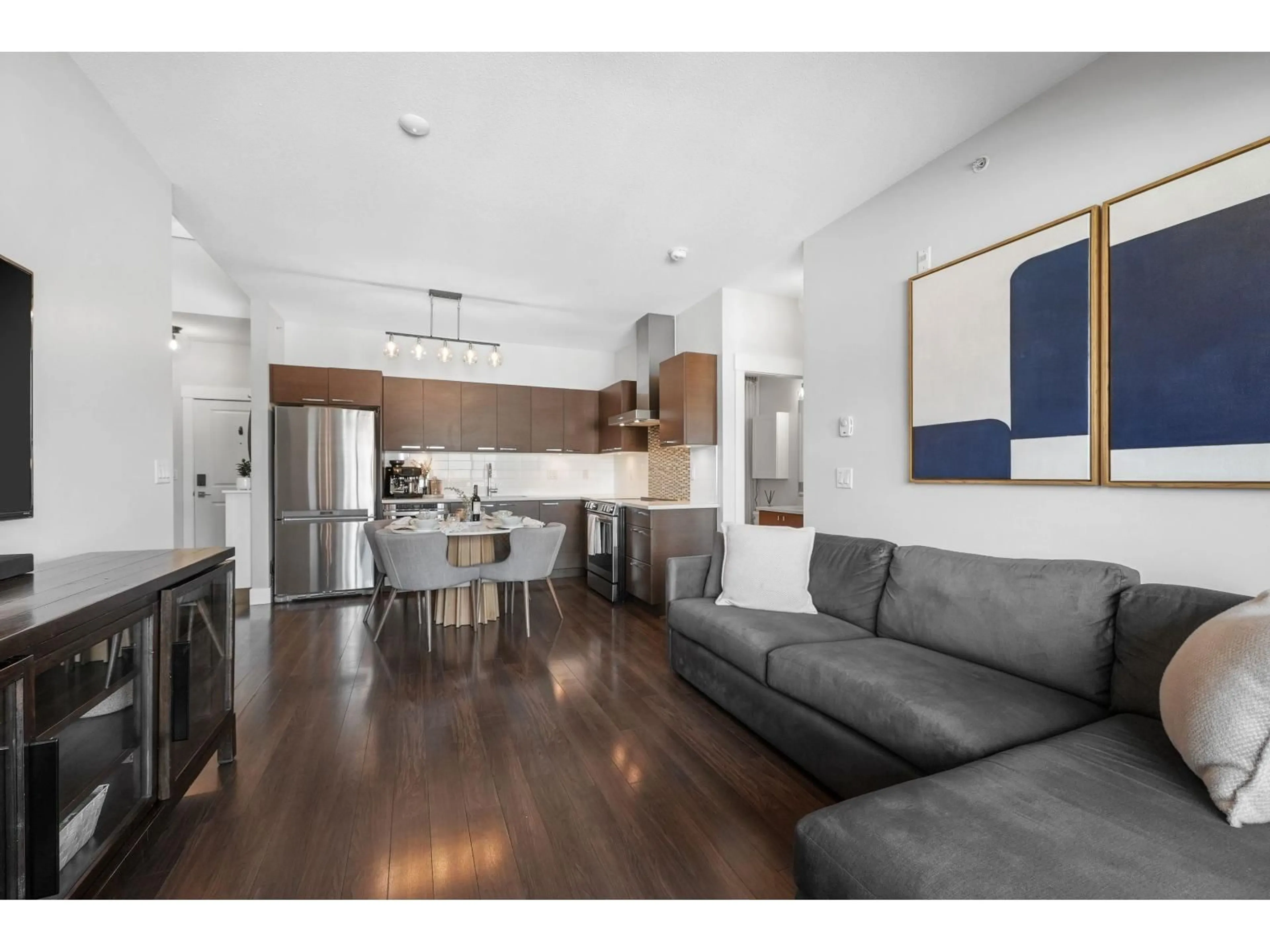 Open concept kitchen, wood/laminate floor for 406 - 5811 177B STREET, Surrey British Columbia V3S4J4