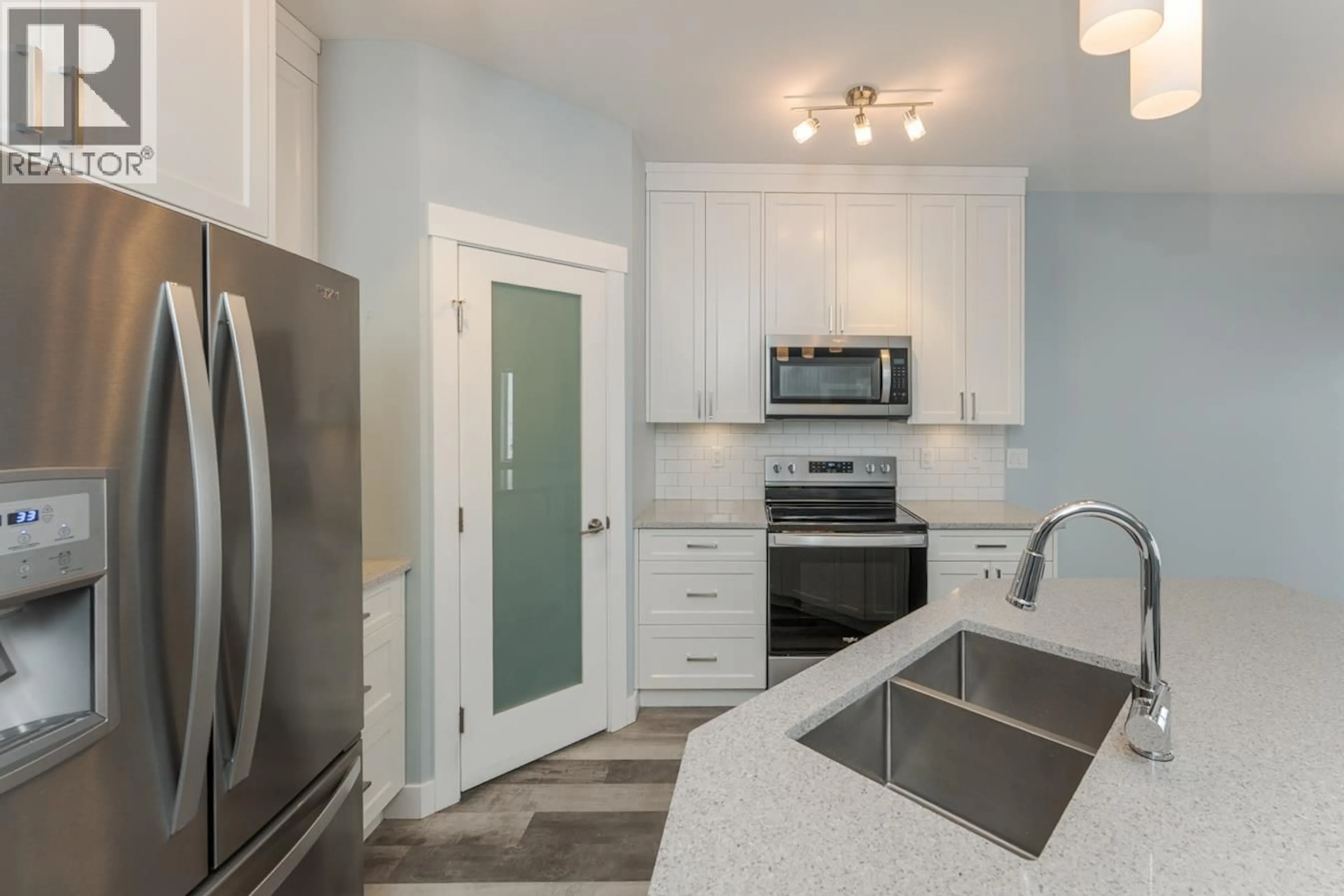 Open concept kitchen, ceramic/tile floor for 402 - 2425 ROWE STREET, Prince George British Columbia V2N0J3