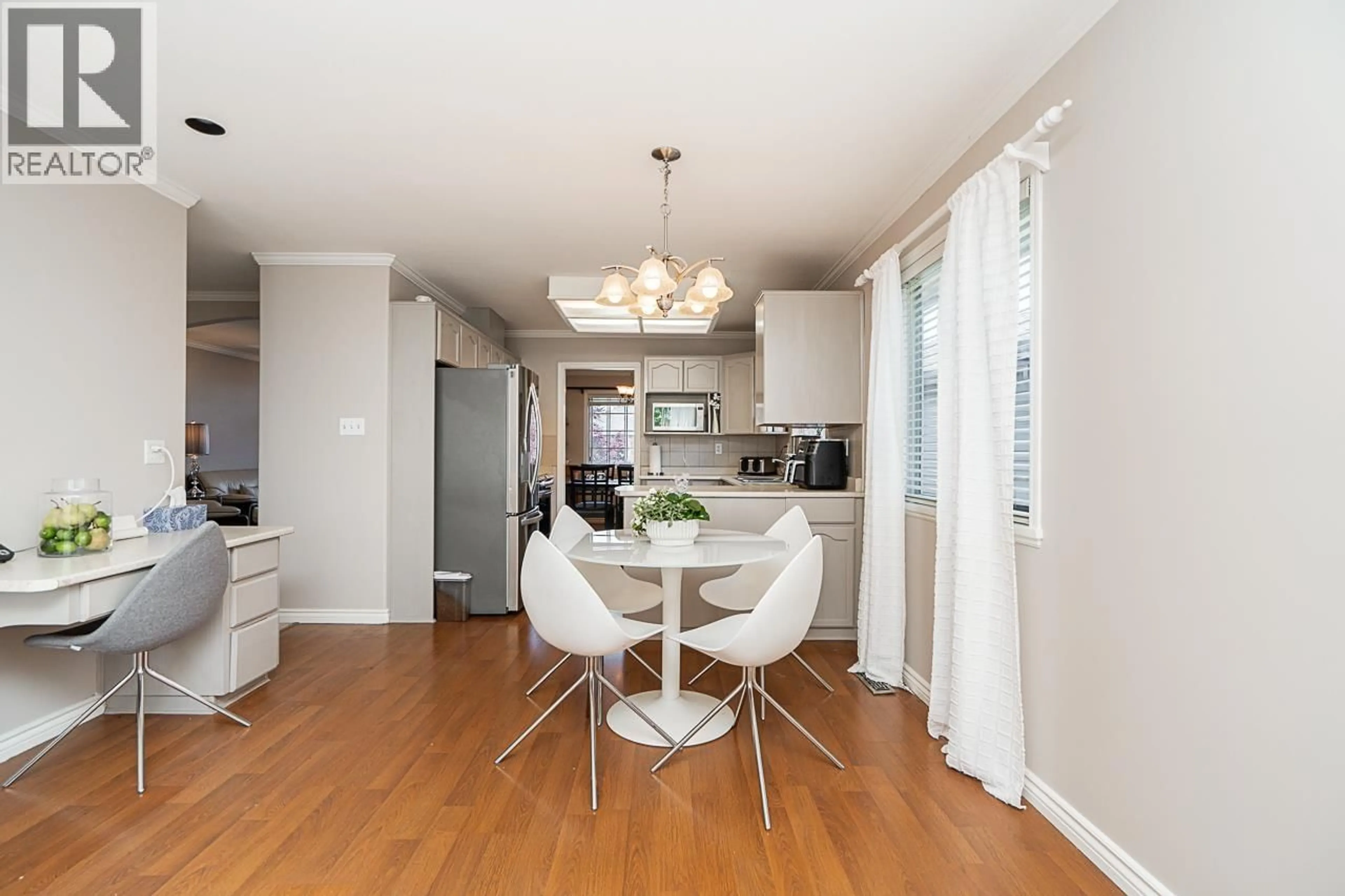 Open concept kitchen, wood/laminate floor for 1932 JACANA AVENUE, Port Coquitlam British Columbia V3C5Y4