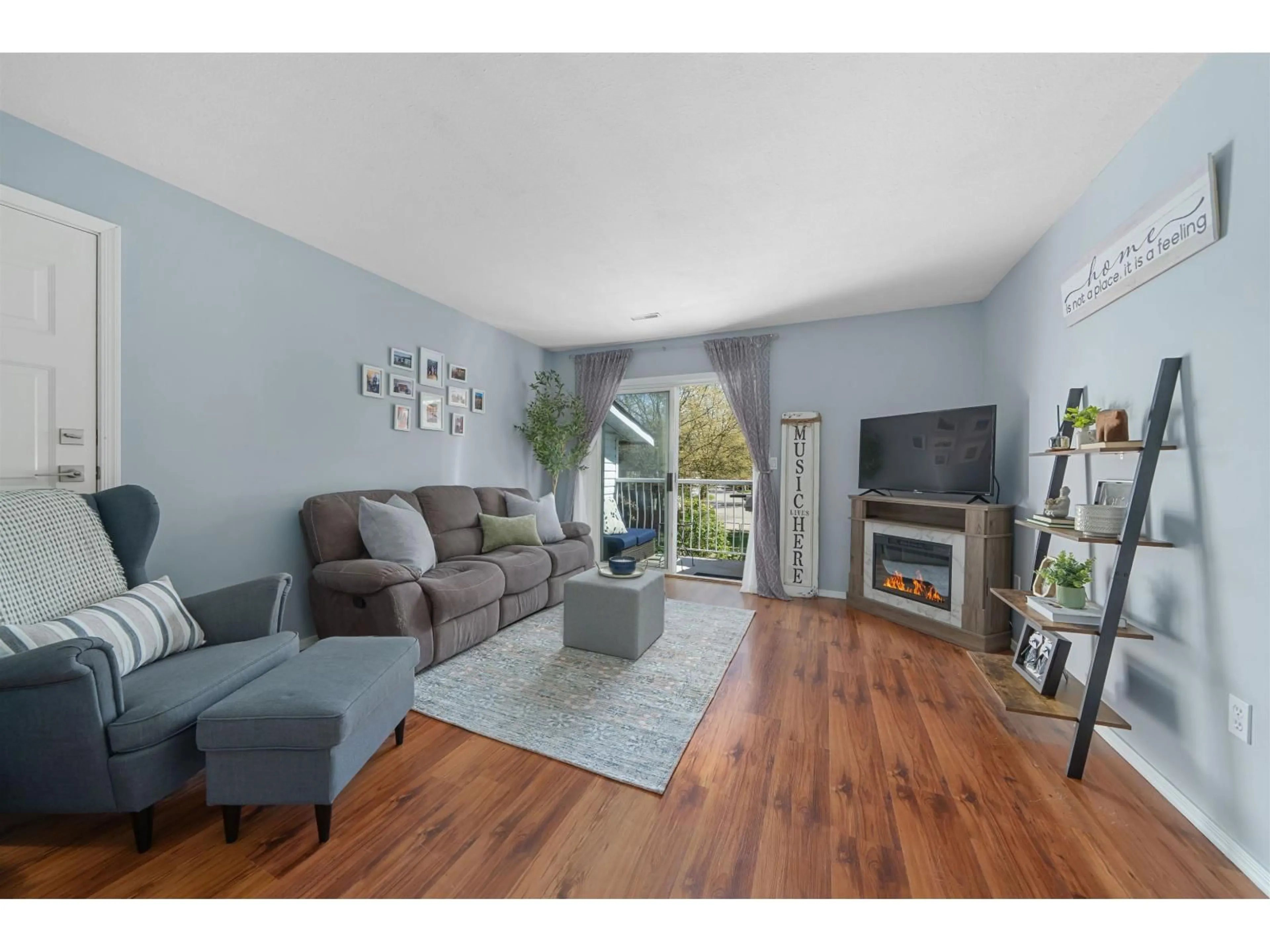 Living room with furniture, wood/laminate floor for 30 - 7715 LUCKAKUCK PLACE, Chilliwack British Columbia V2R3N6
