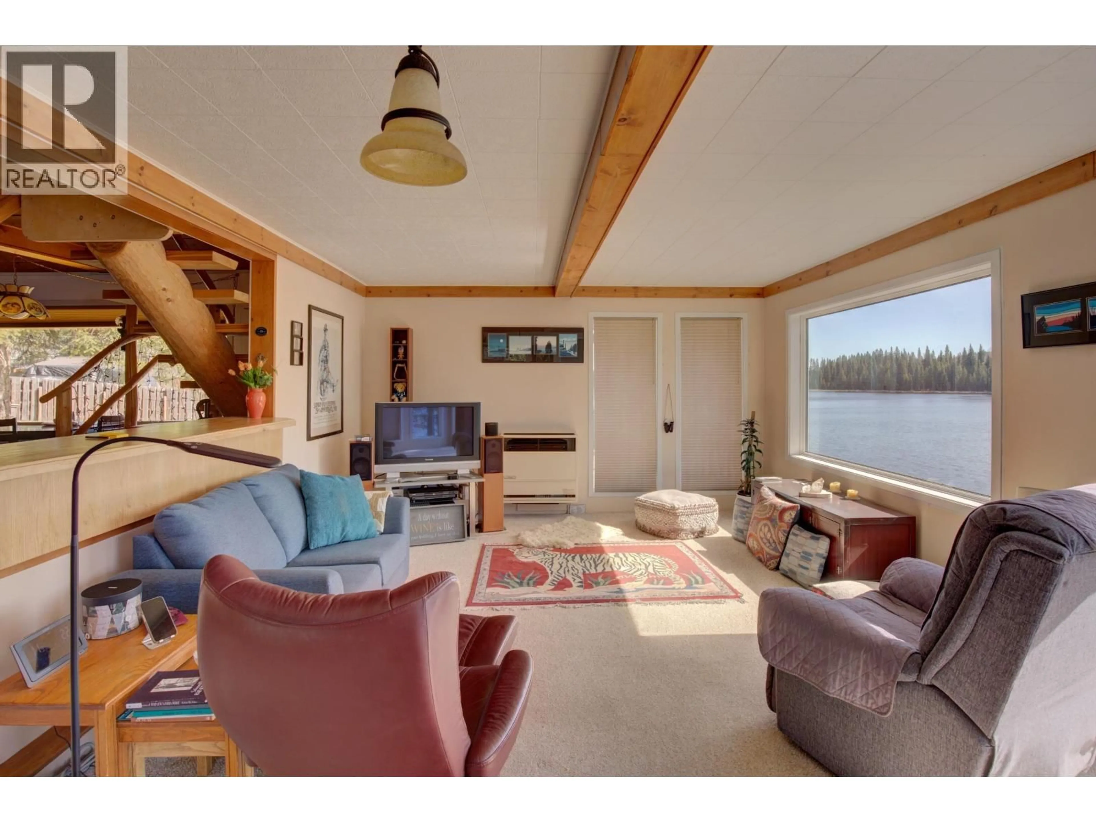 Living room with furniture, wood/laminate floor for 2405 STARLIKE LAKE ROAD, Horsefly British Columbia V0L1L0